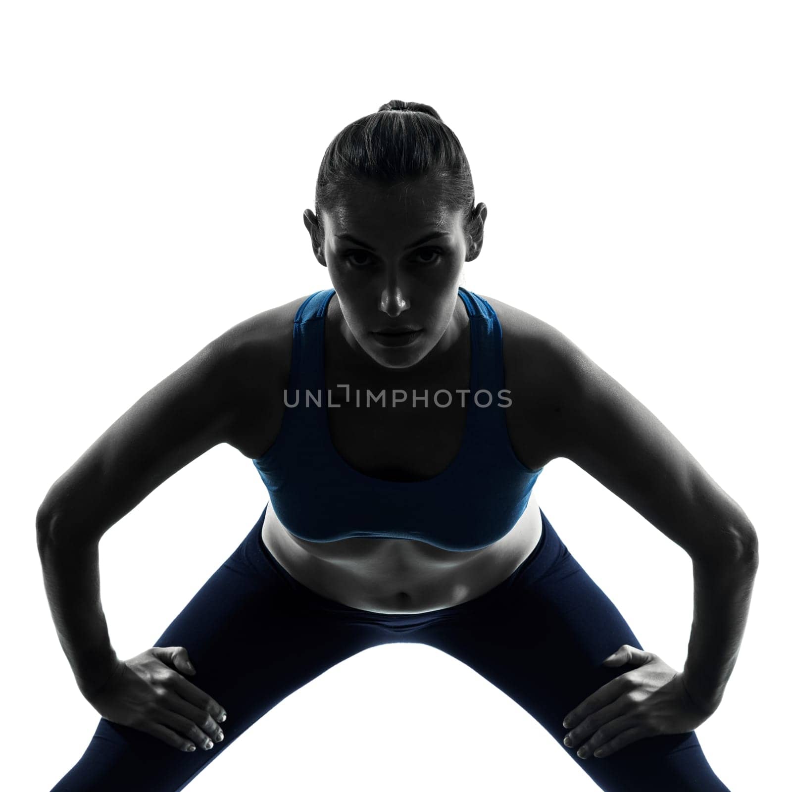 one caucasian woman exercising yoga in silhouette studio isolated on white background