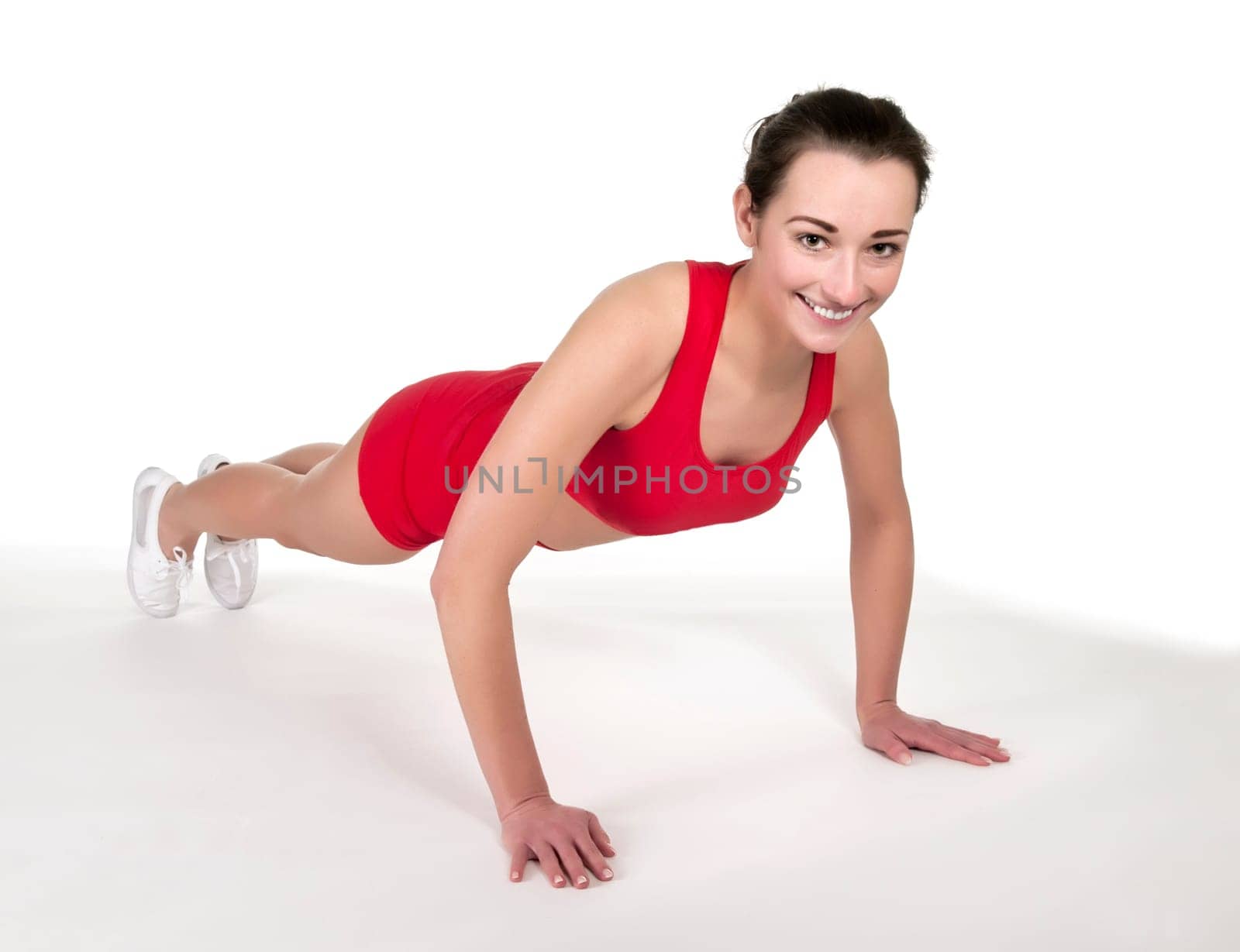 Young woman showing push-ups