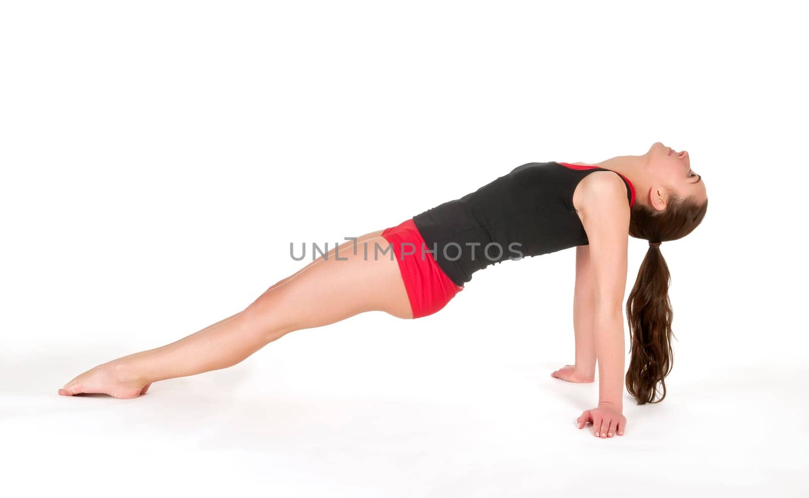 Young woman showing gymnastics exercise