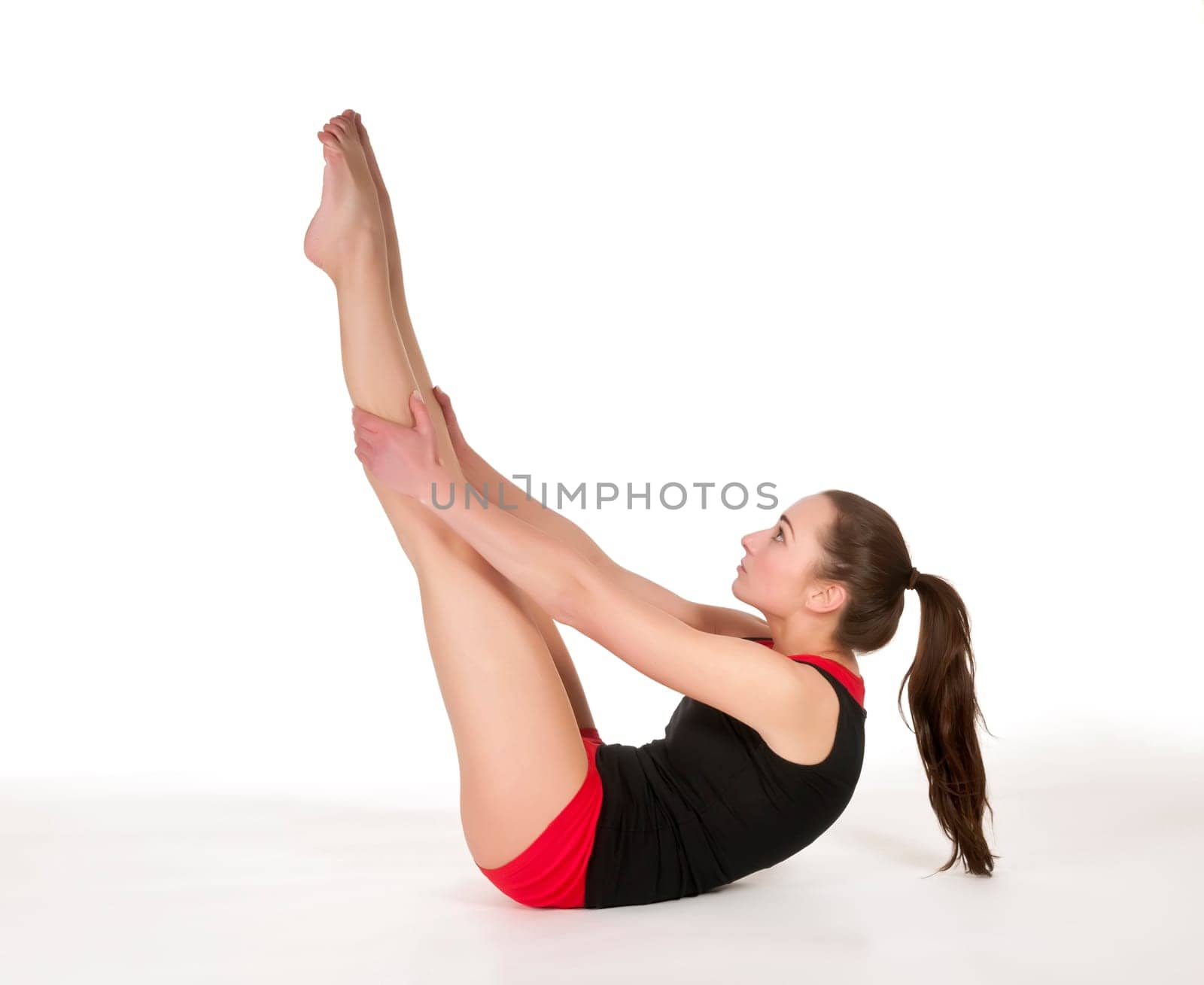Young woman showing gymnastics exercise