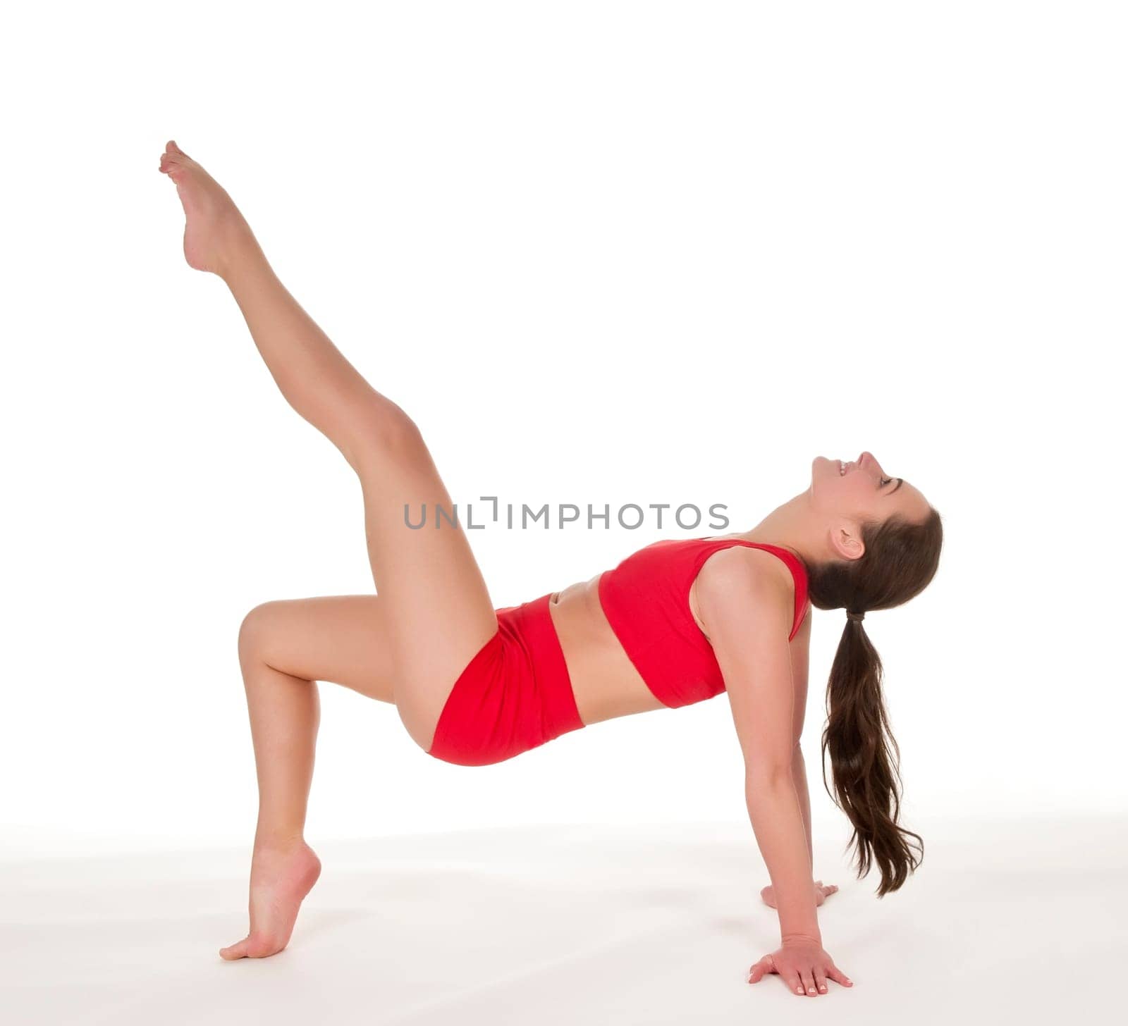 Young woman showing gymnastics exercise