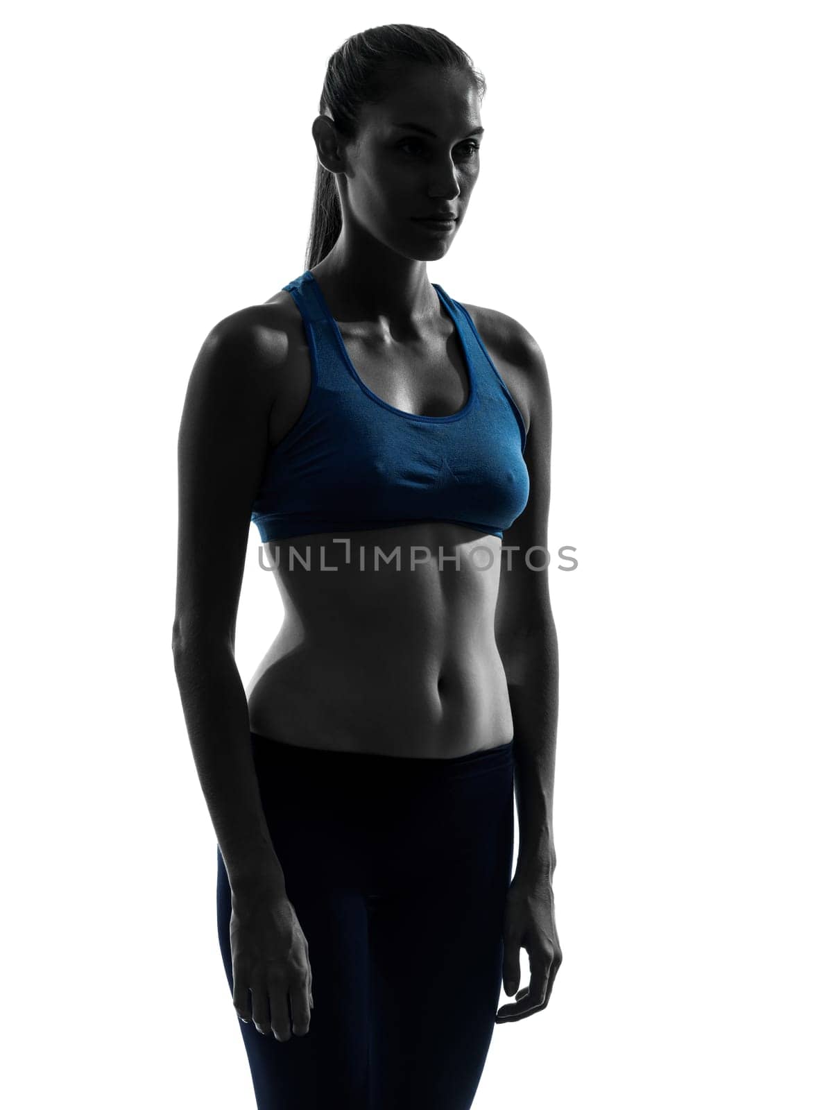one caucasian woman exercising yoga portrait in silhouette studio isolated on white background