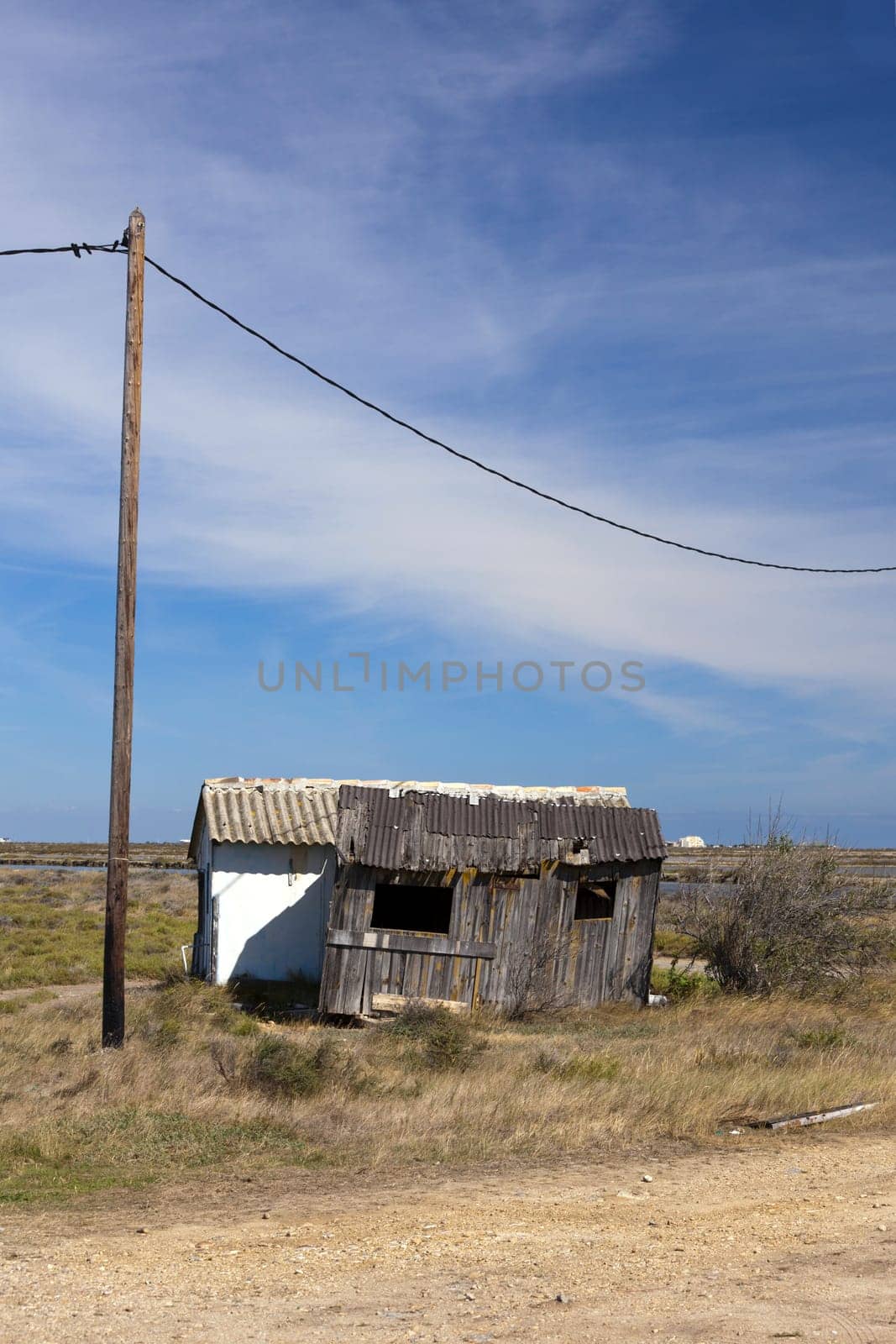 Old dilapidated workers' huts at the salt works in Gruissan in southern France