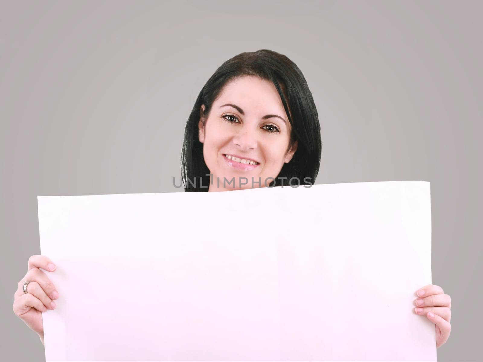 Beautiful woman with a banner smiling