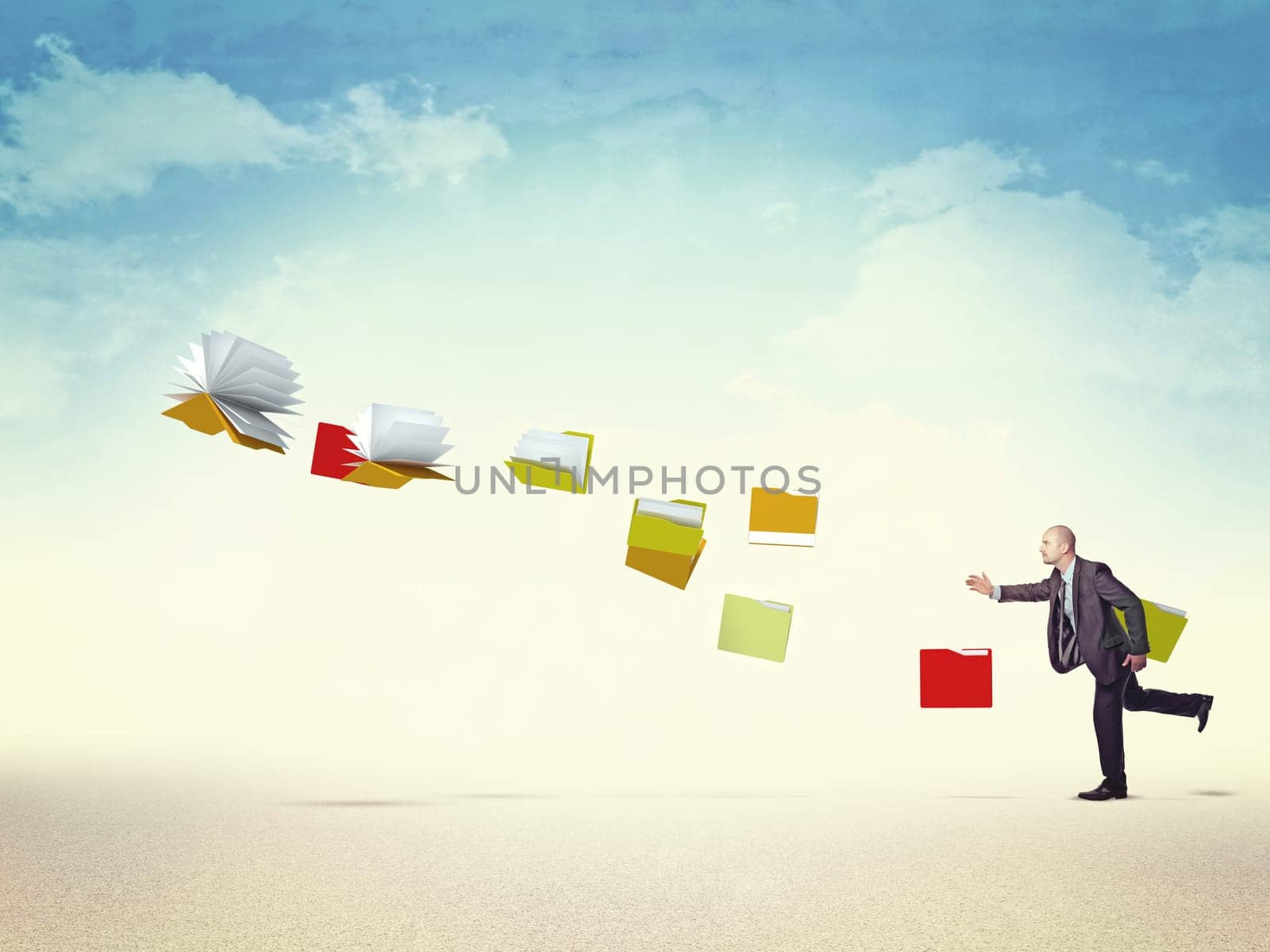 businessman follow flying file and documents