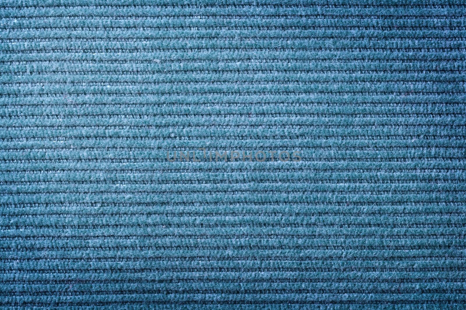 Blue corduroy fabric texture for background. Close up shot