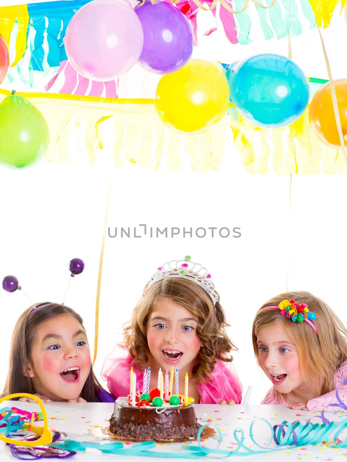 children kid girls birthday party looking excited chocolate candles cake