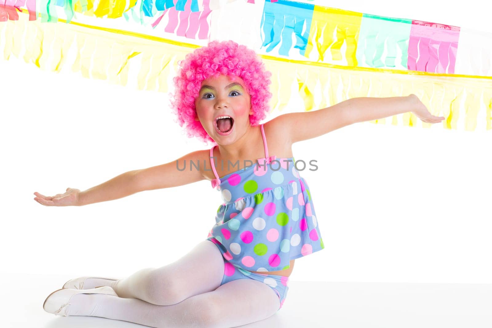child kid girl with party clown pink wig funny happy open arms expression and garlands