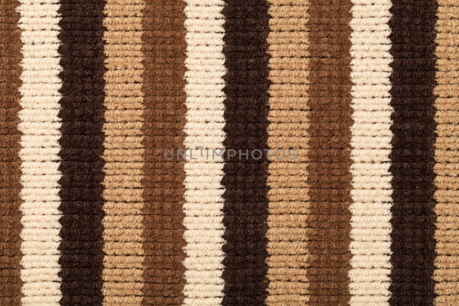 Knitted fabric texture for background. Brown stripes, closeup