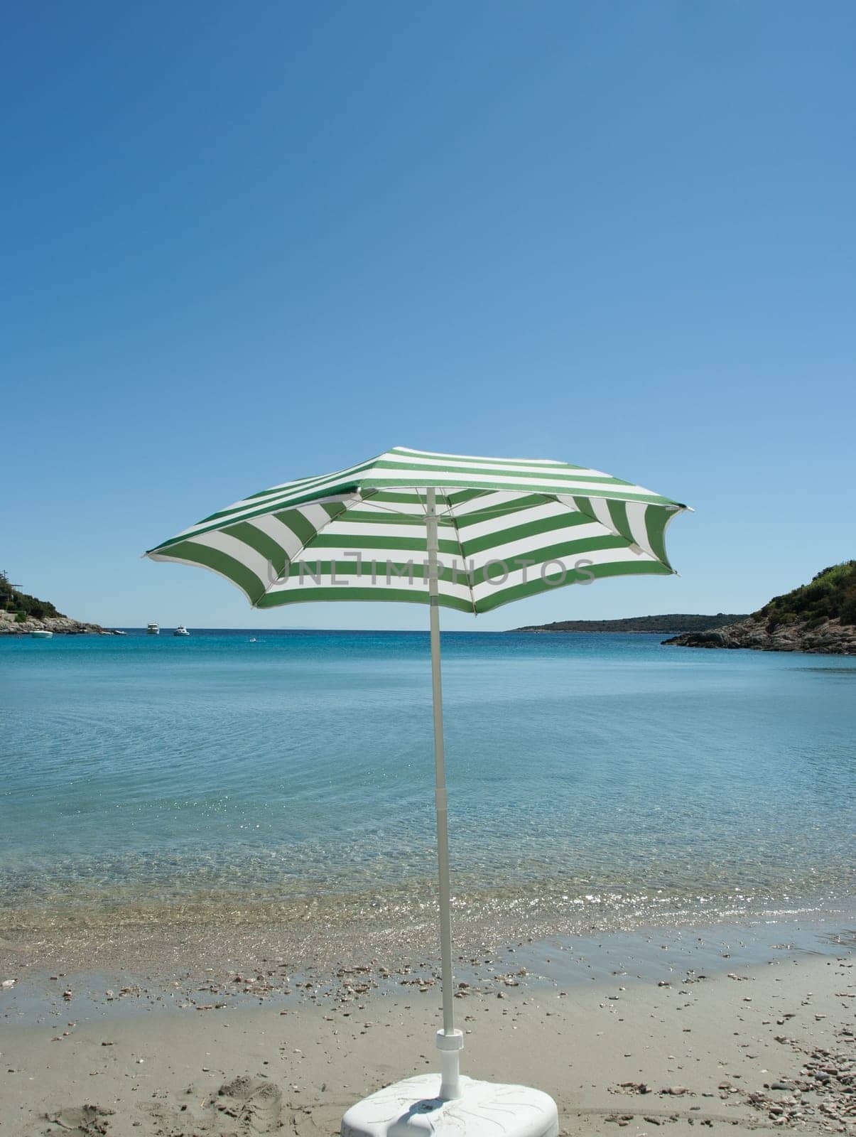 Parasol on the sand beach (Vis, Croatia)