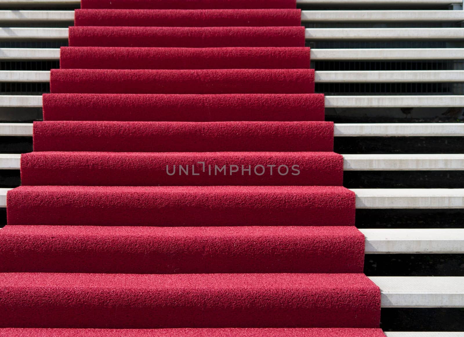 stair with red carpet in front of an hotel