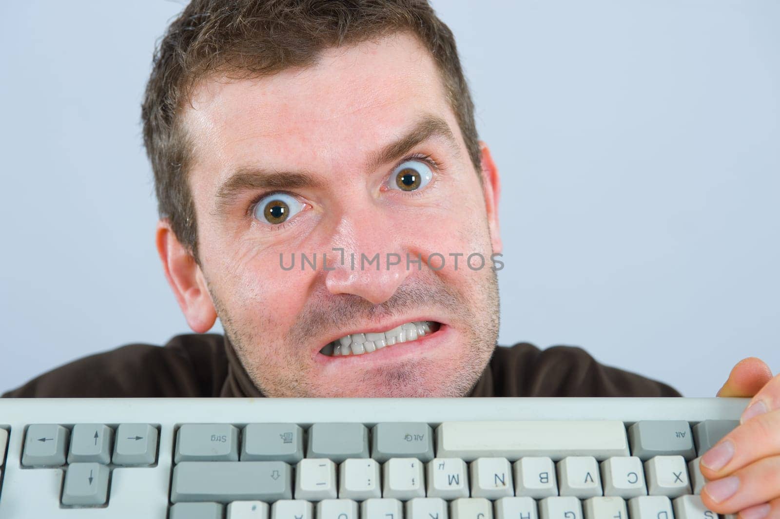 crazy man with computer-keyboard
