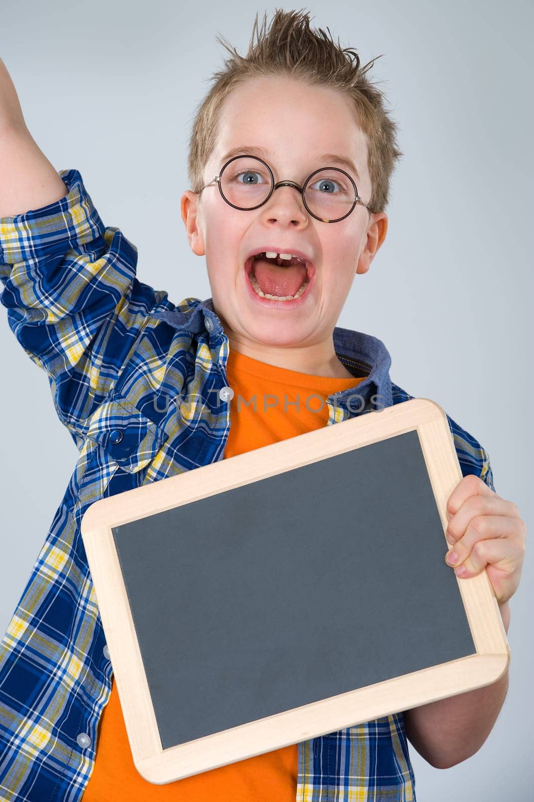 happy boy with little blackboard