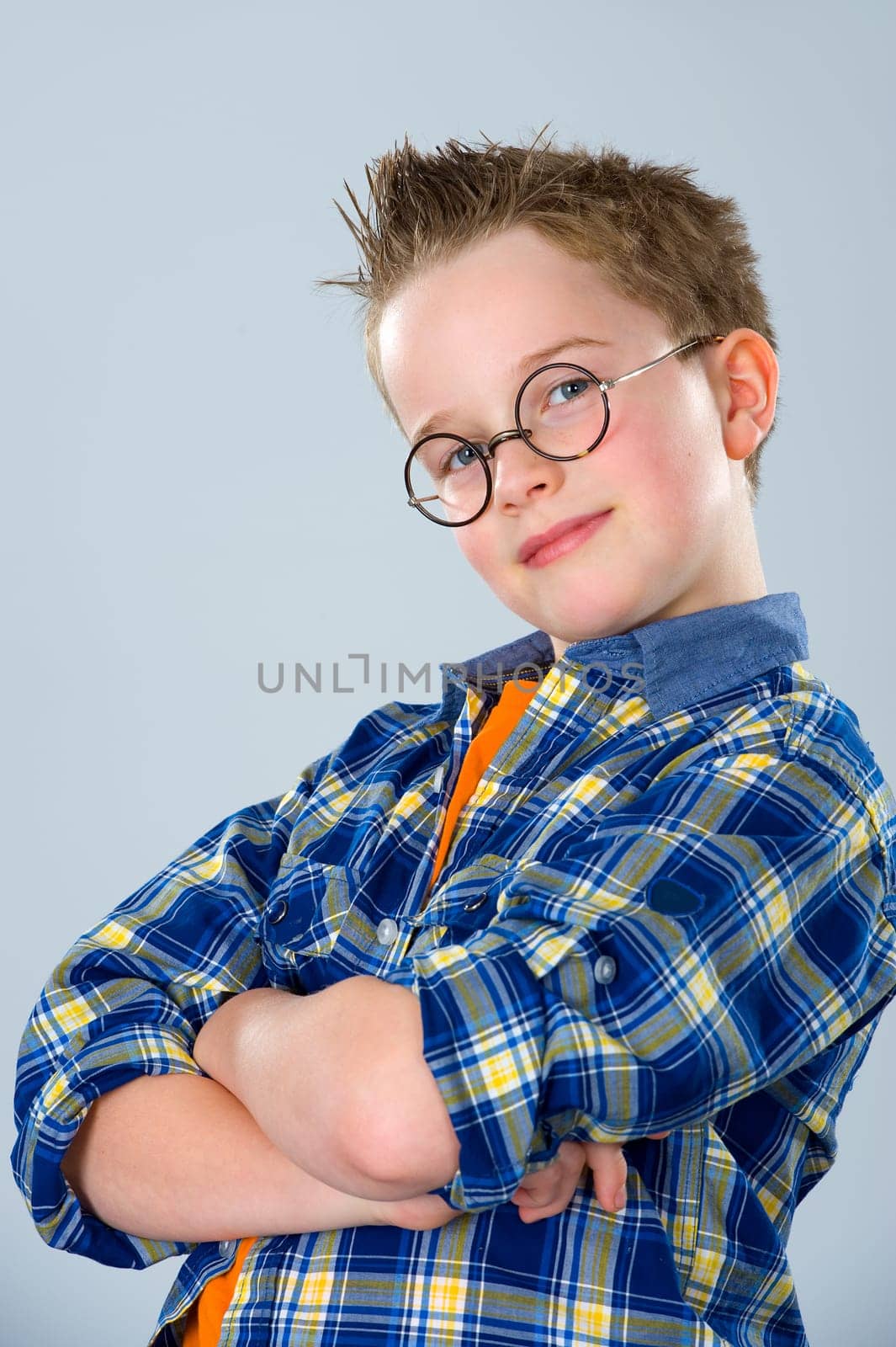 boy with stylish hair and round glasses