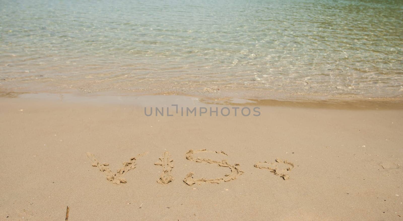 Vis word in the sand at the beach