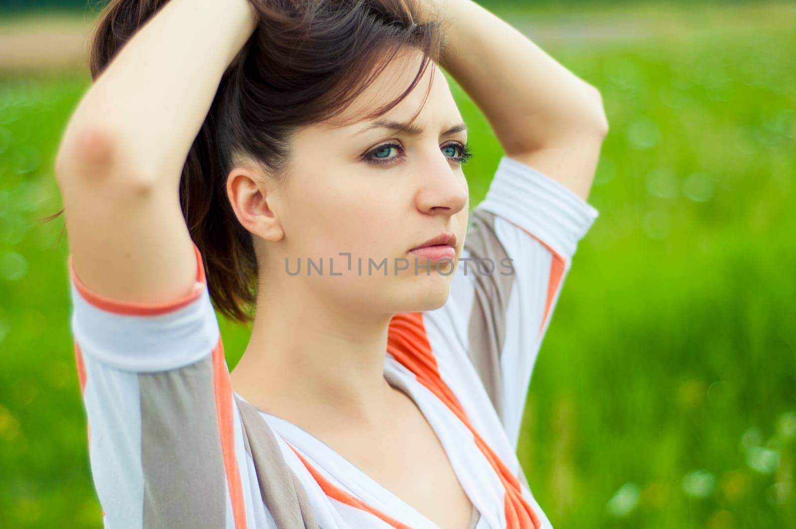 Outdoors portrait of beautiful young brunette girl