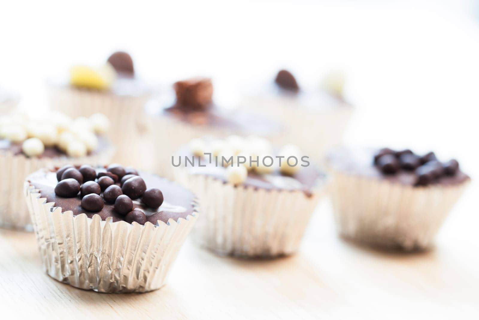 Gourmet chocolate cupcakes in silver cupcake wrappers
