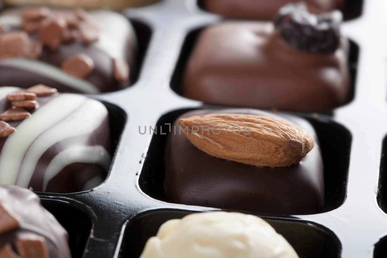Gourmet chocolates topped with an almond.
