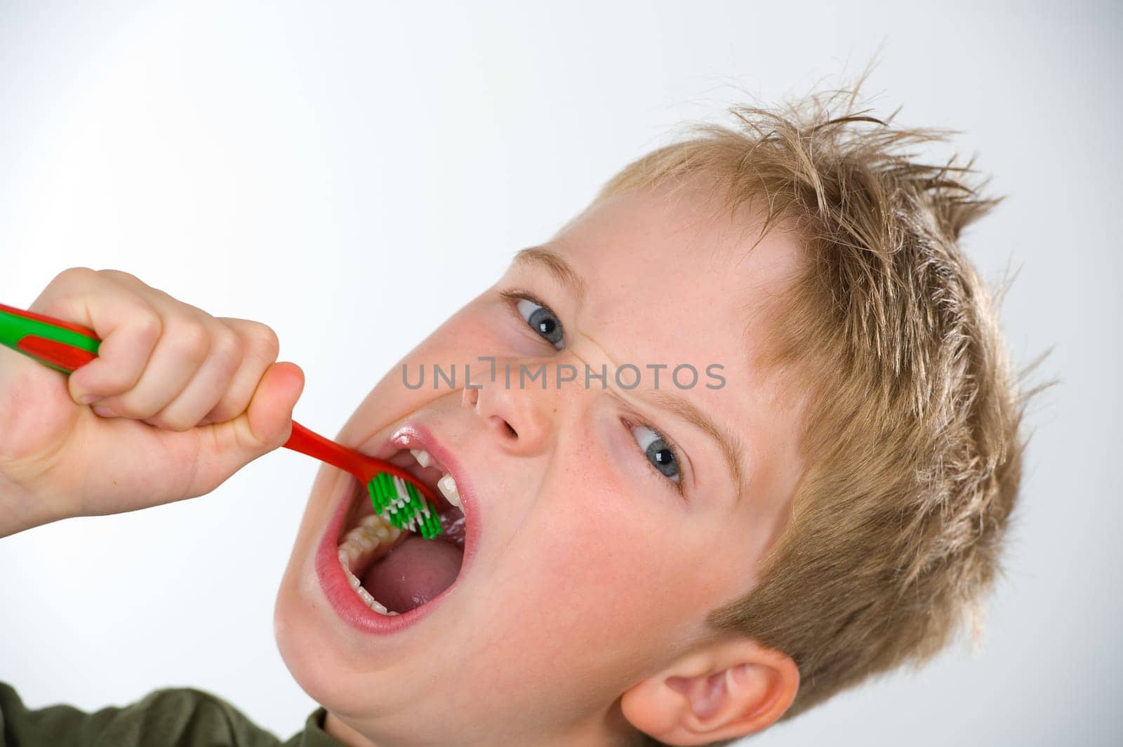 boy is brushing tooth