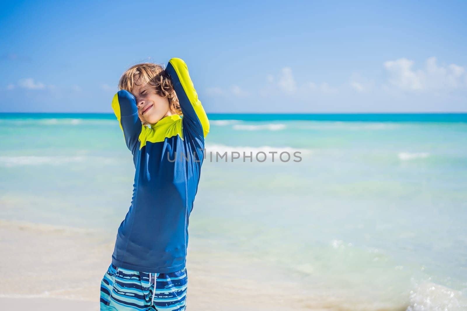 A carefree boy explores the wonders of the beach, with the sun-kissed shoreline as his playground, embodying the spirit of childhood adventure.