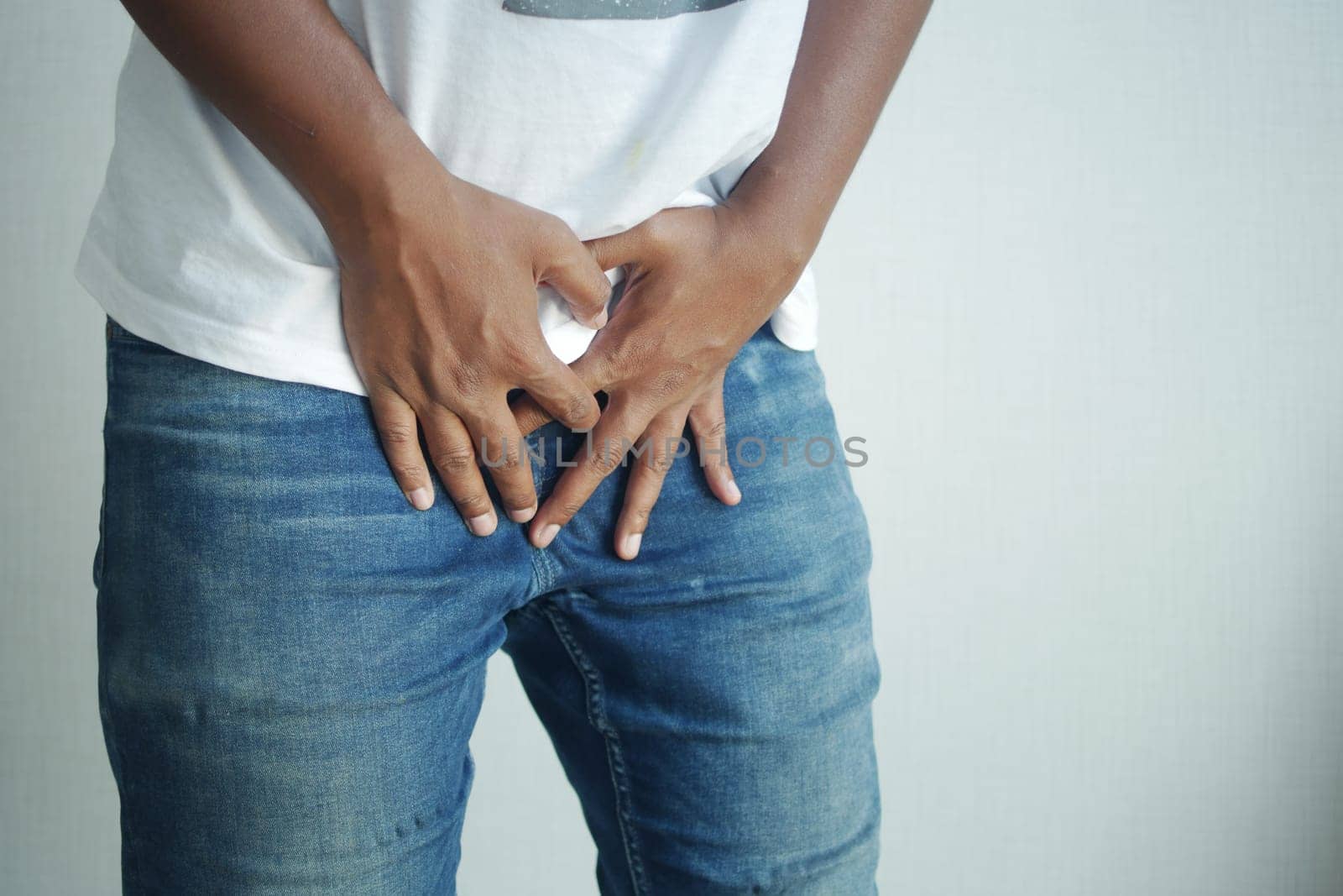 the concept of prostate and bladder problem, crotch pain of a young person .
