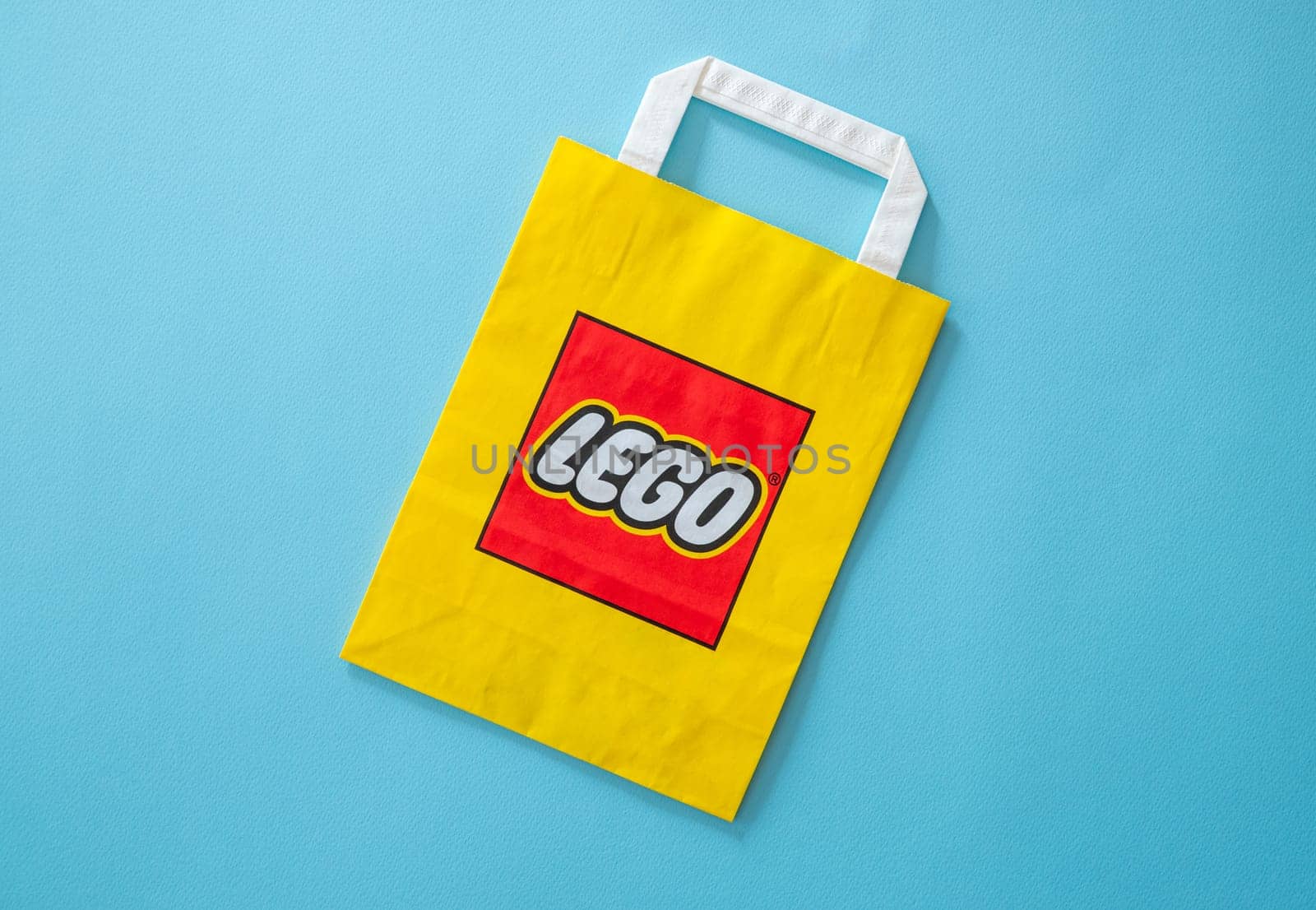Antalya, Turkey - October 26, 2023: Branded yellow paper bag of Lego Group Corporation with logo