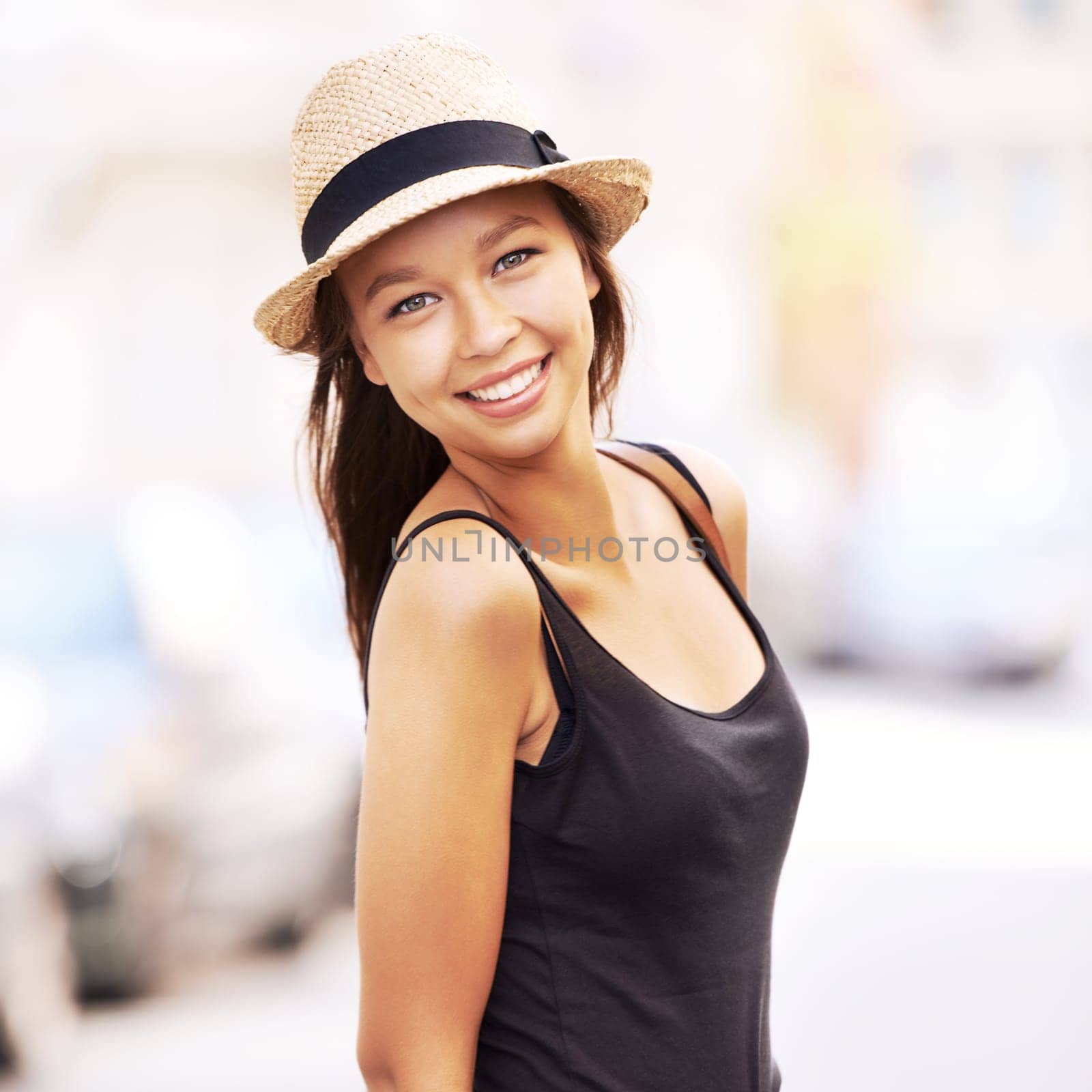 Woman, portrait and fashion or street travel style, summer look for weekend vacation. Female person, tourist and face hat for sunshine city road walking or outdoor adventure, relax or holiday clothes.