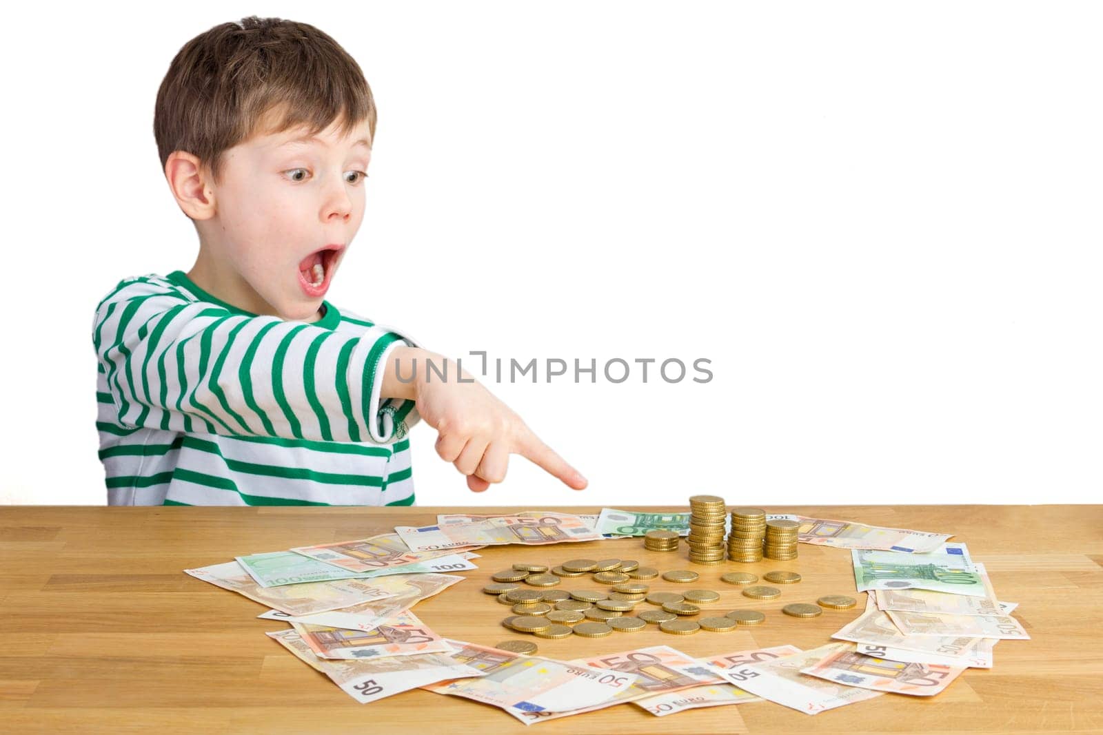 Boy points his index finger at a lot of money