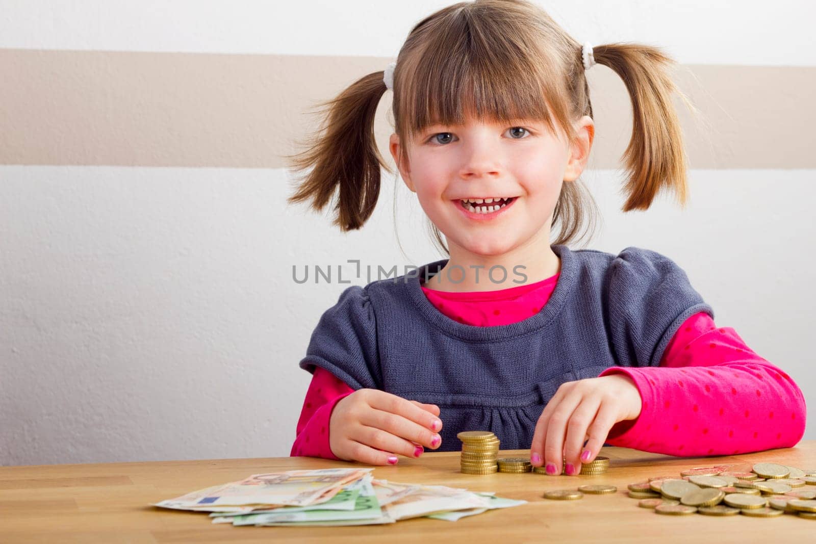 Child is happy about a lot of money