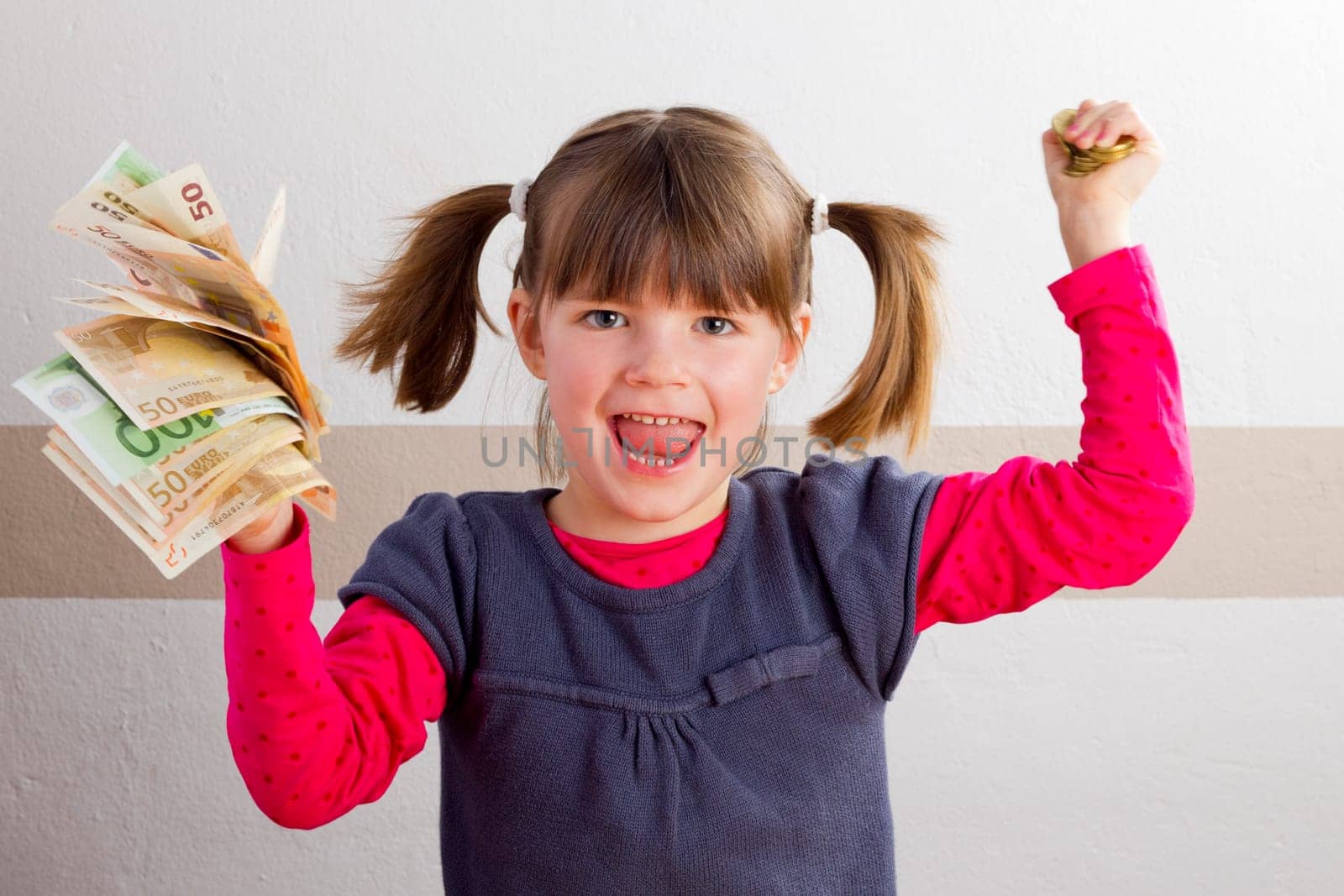 Cheering girl with money in her hands