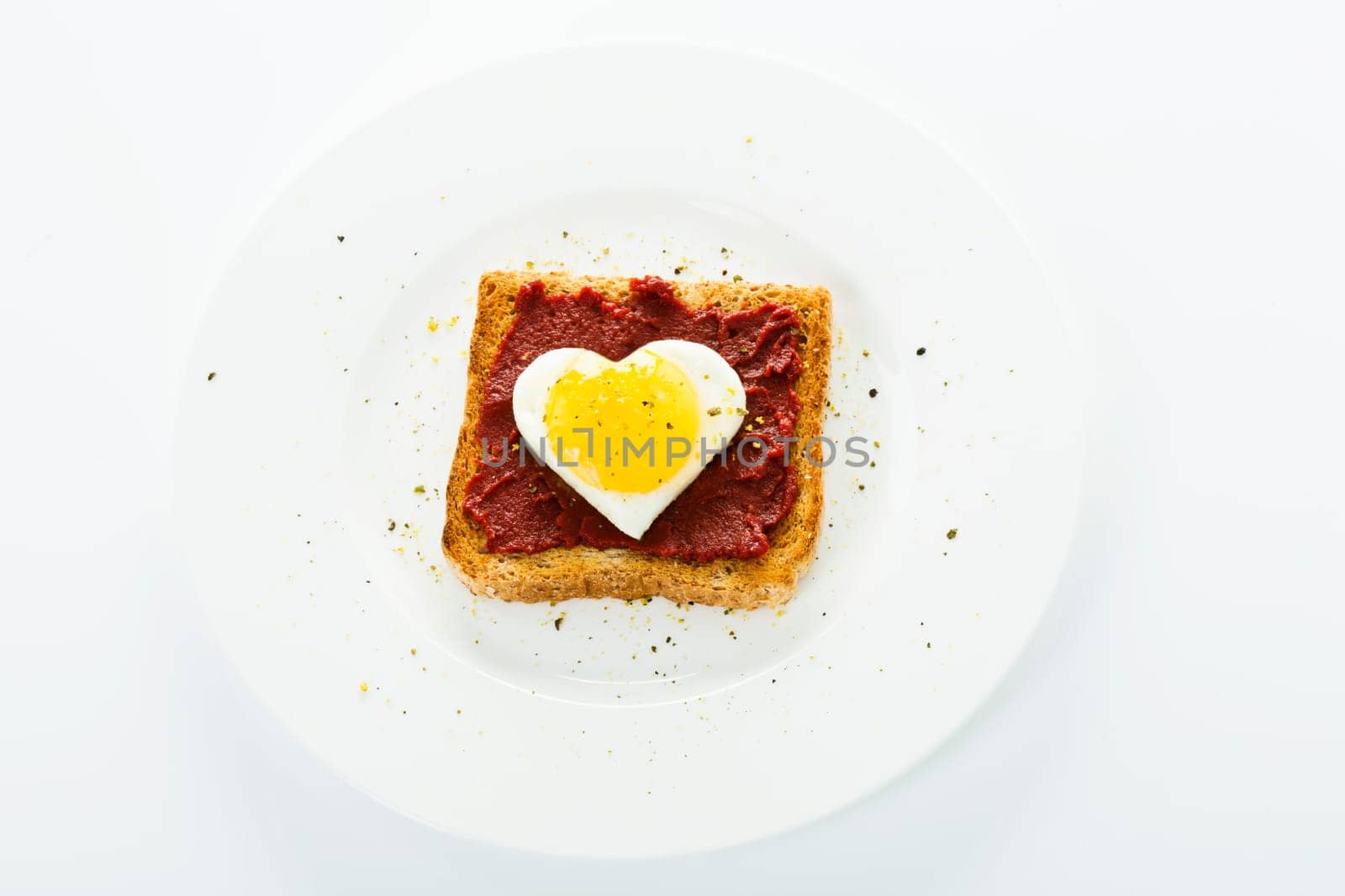 Fried egg heart on toast
