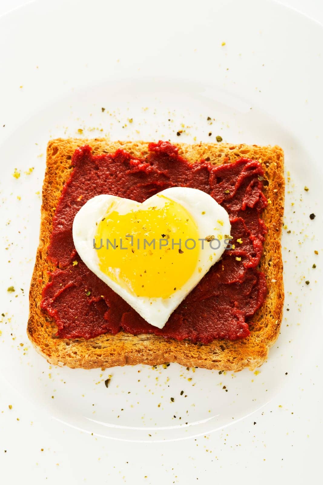 Fried egg heart on toast