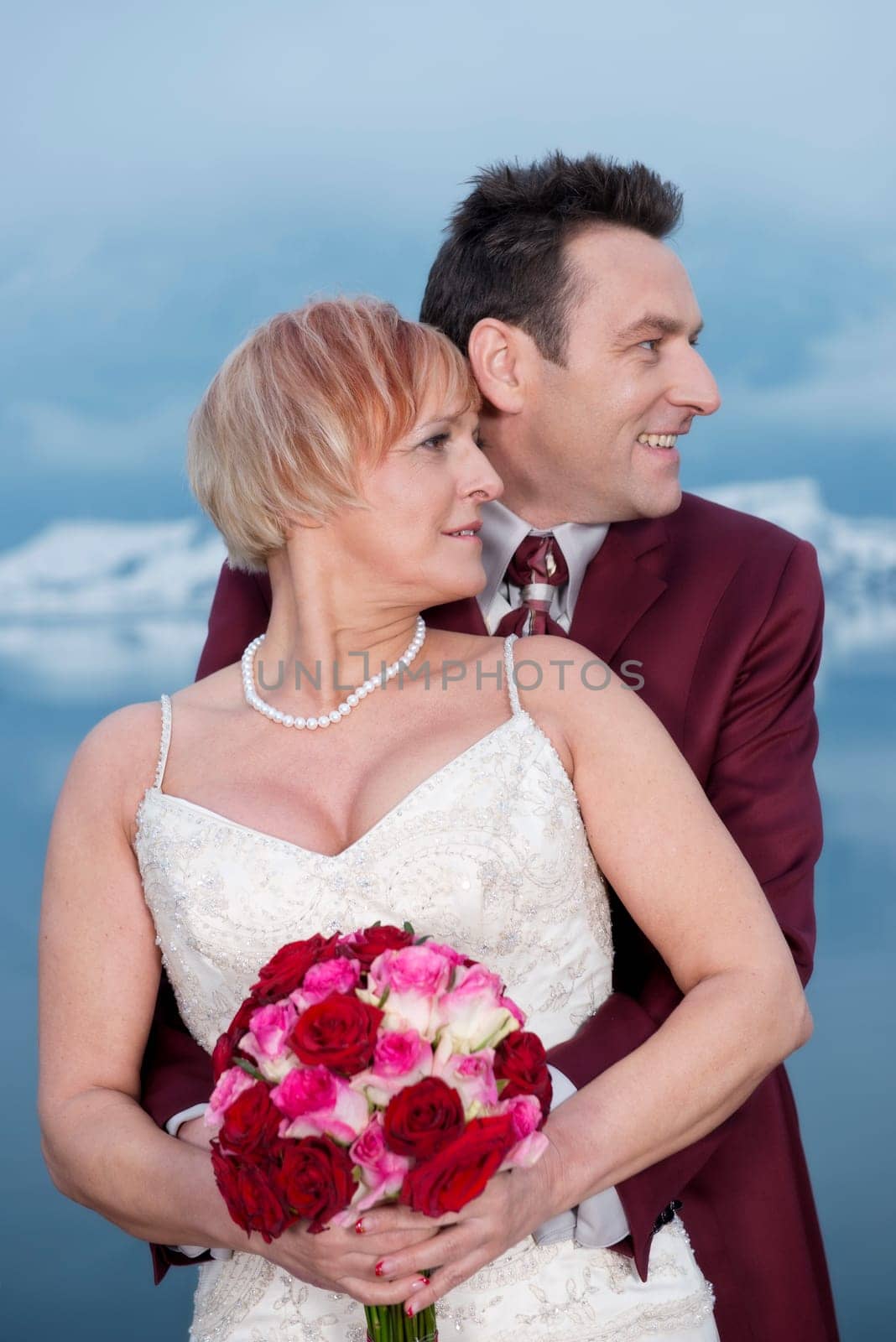 Upper body shot in profile of a bride and groom
