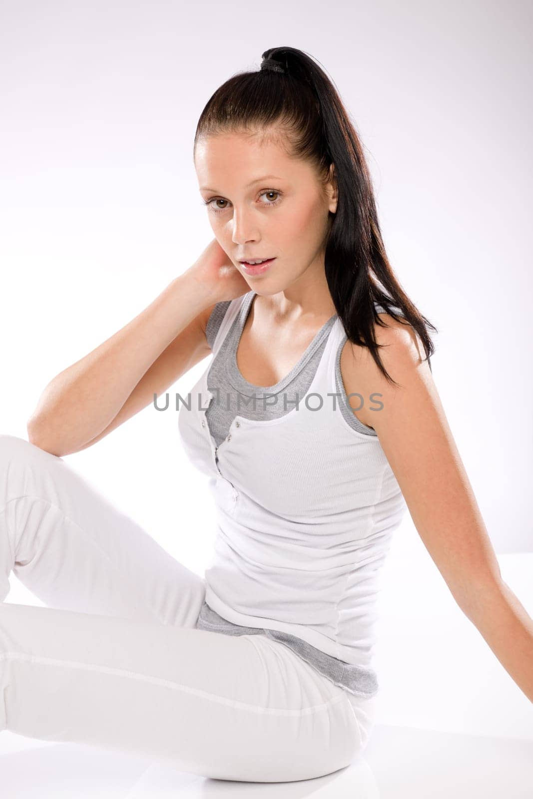 Young Caucasian woman thirsty after exercising relaxing on white background