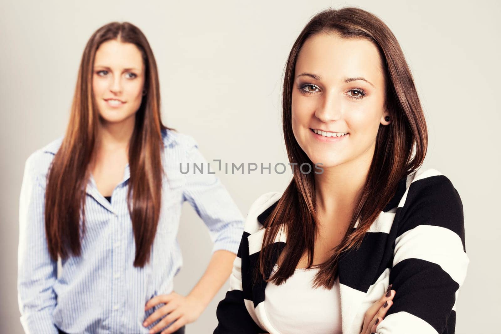 happy teenager with girlfriend in the background