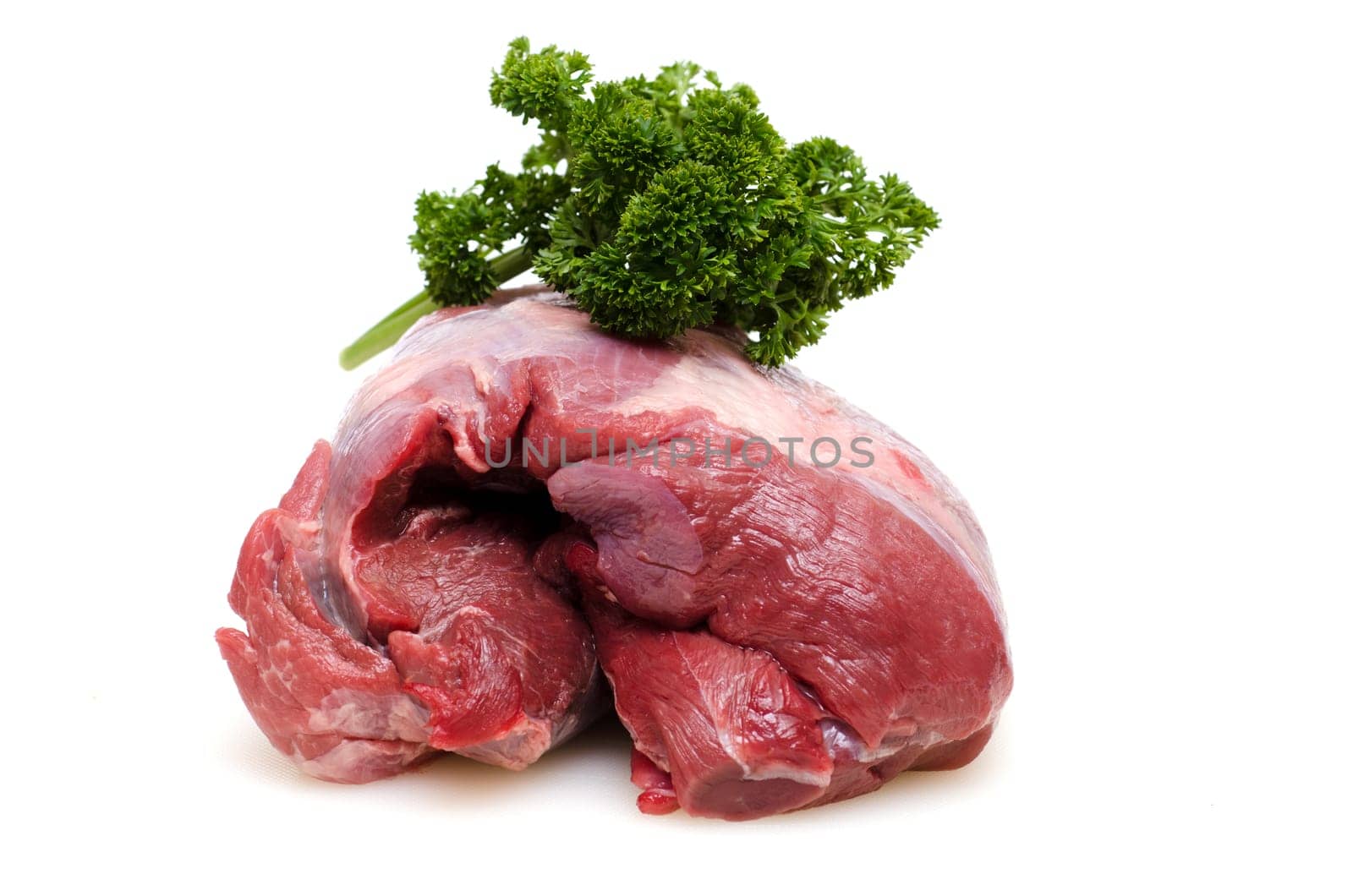 Raw roast wild boar from the shoulder with parsley