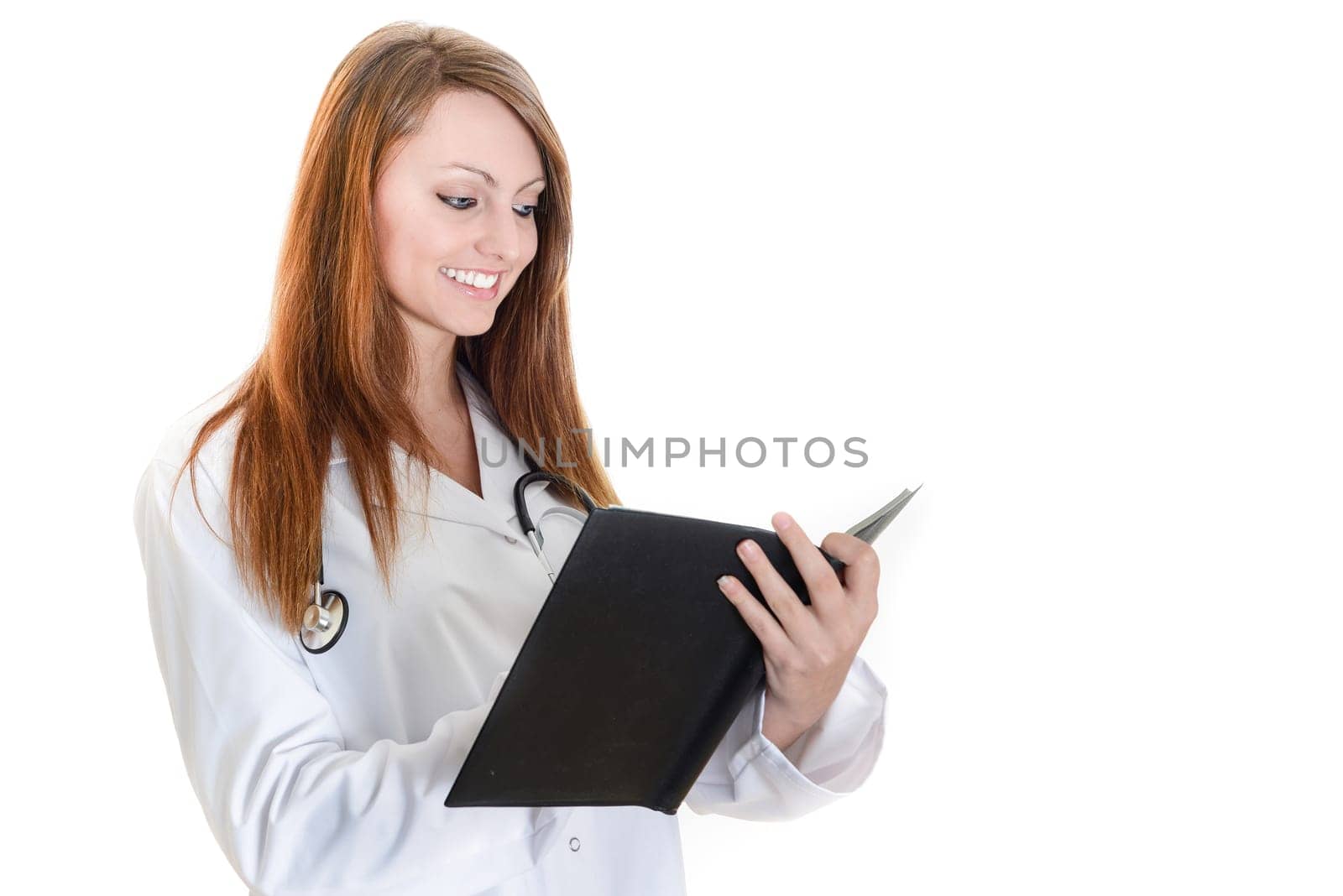 Pretty female doctor isolated writing in a Planner