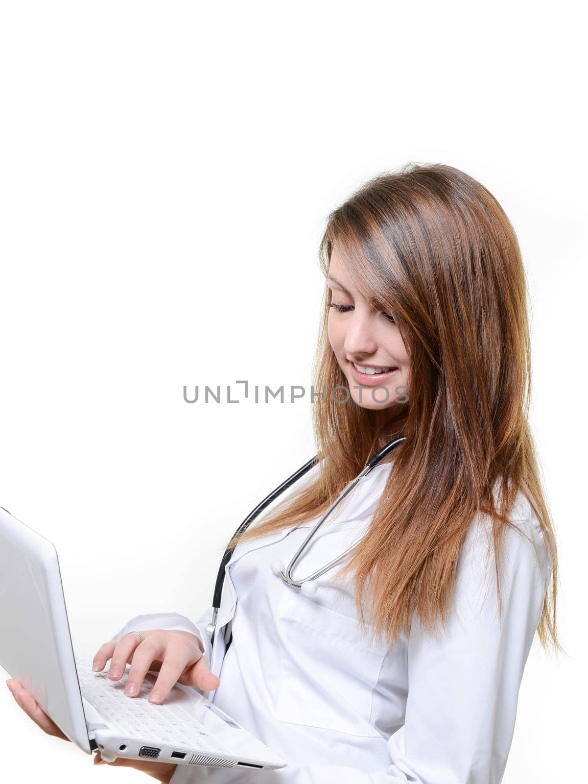 Pretty female student doctor working with notebook