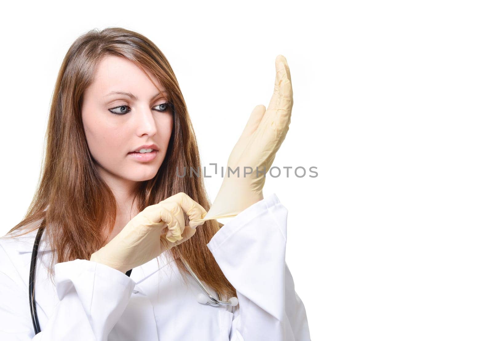 Pretty female doctor is putting protective glove