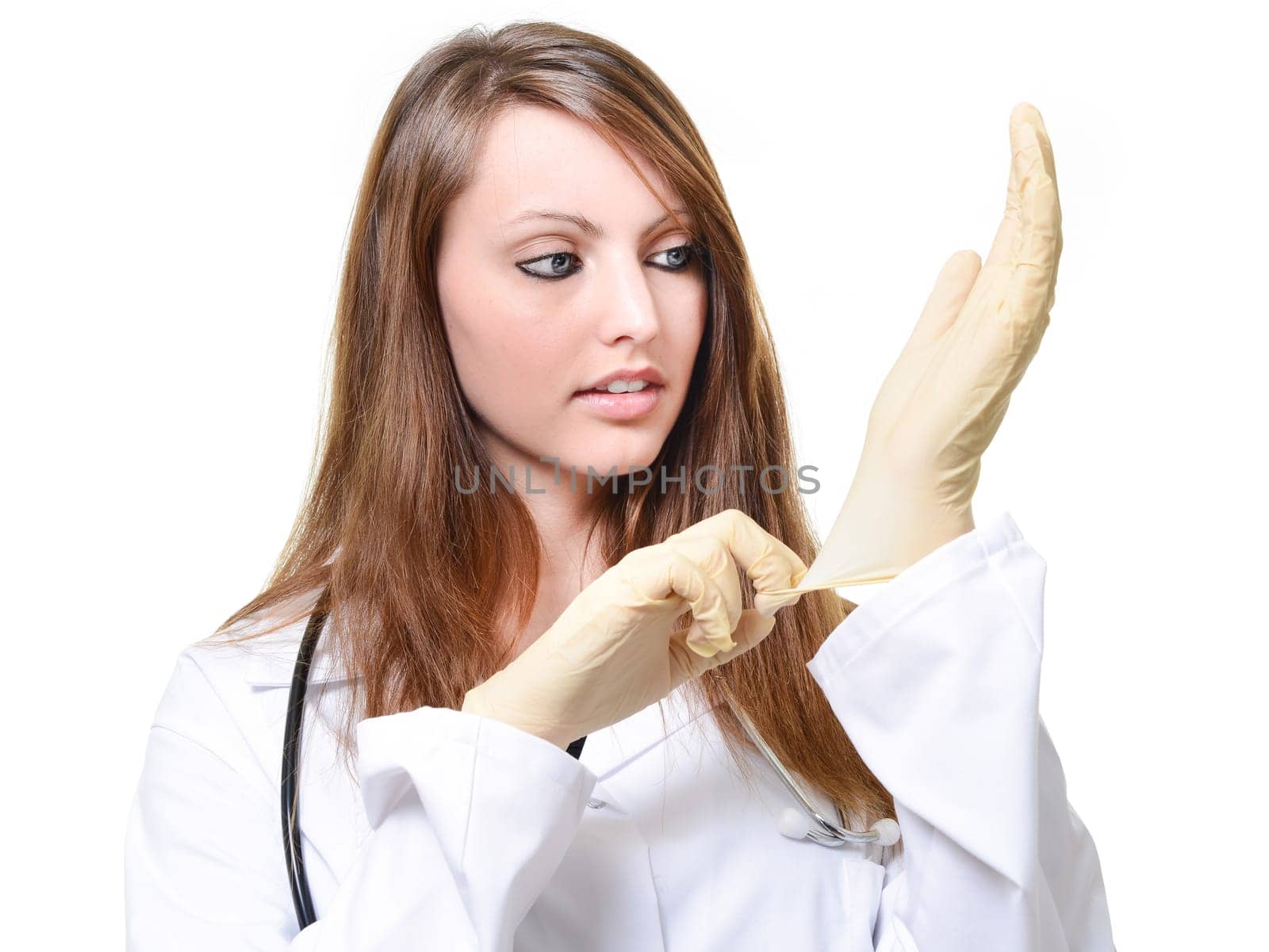 Pretty female doctor is putting protective glove