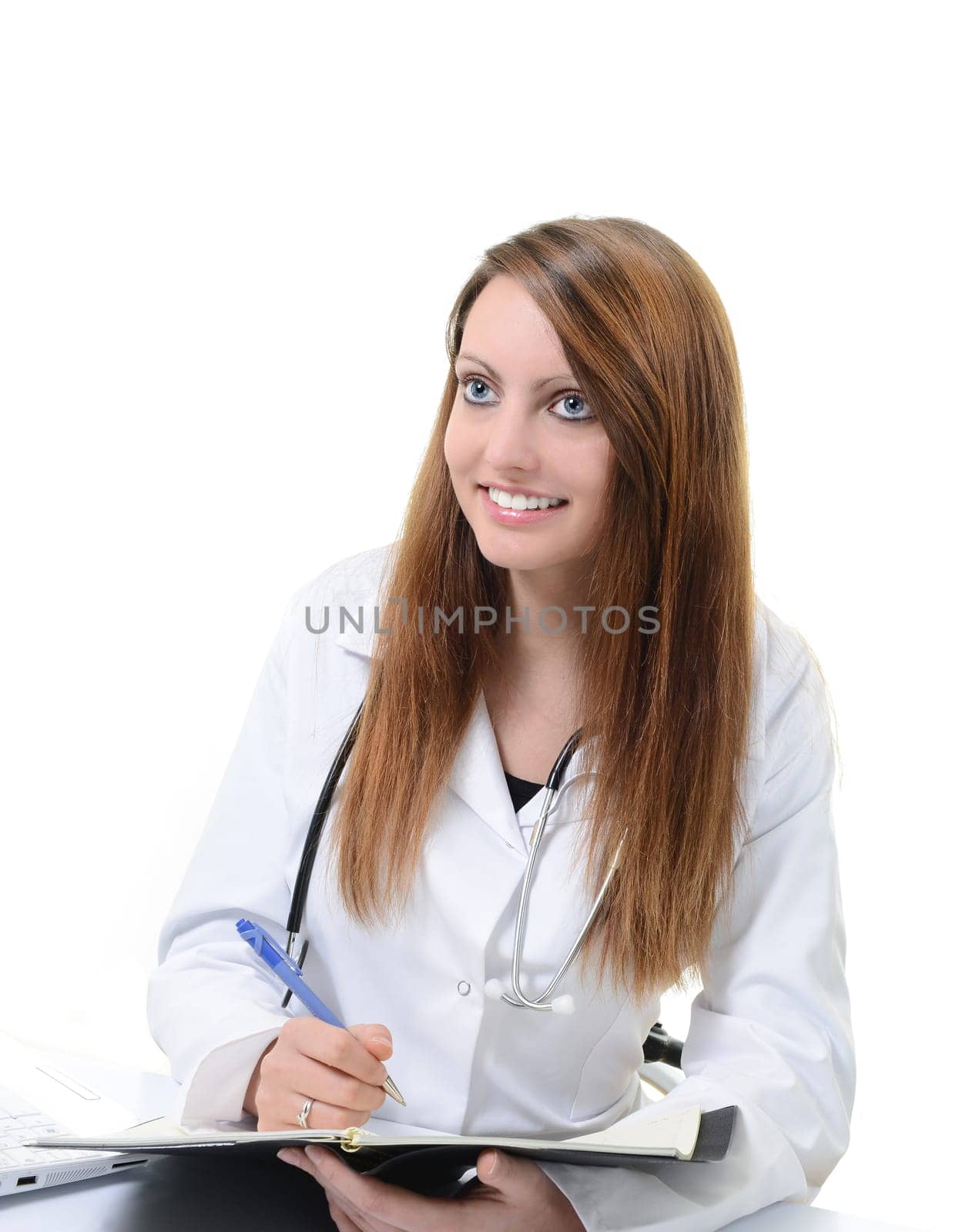 Pretty female doctor isolated writing in a Planner