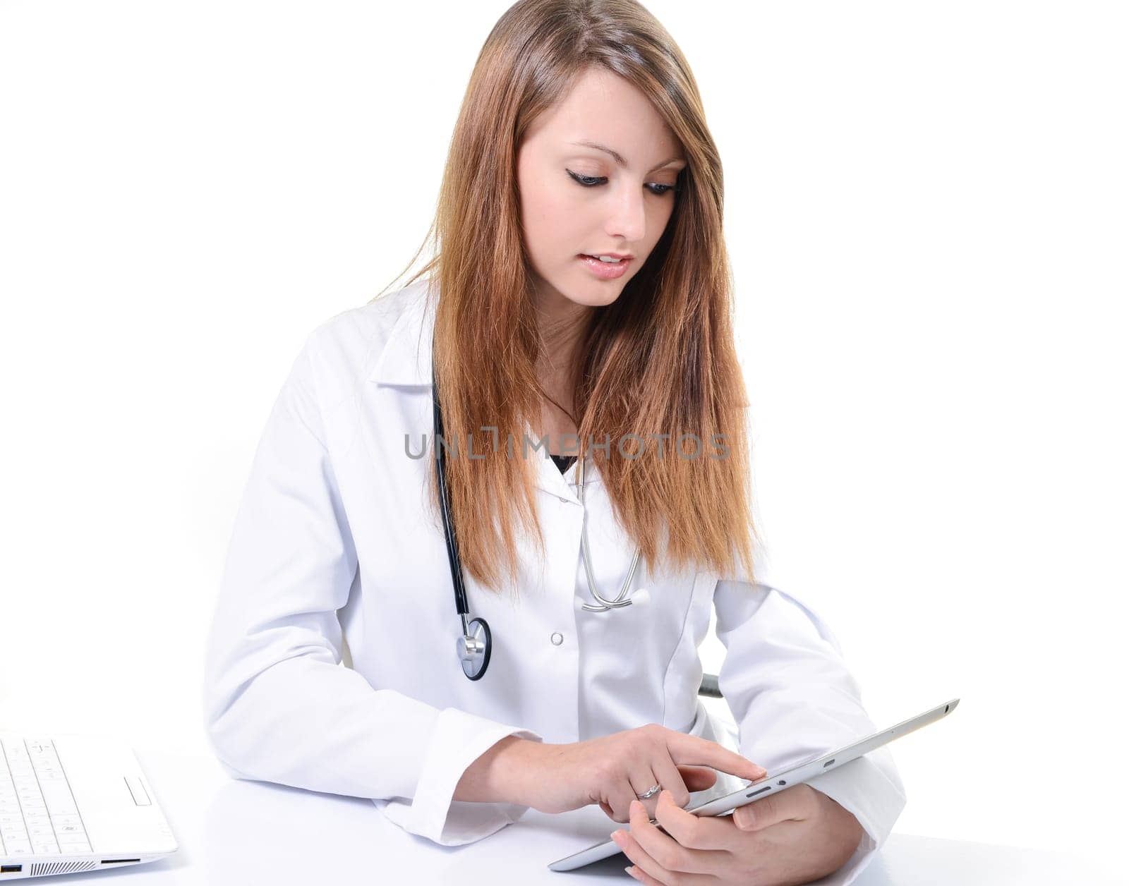 Pretty female student doctor working with an digital tablet