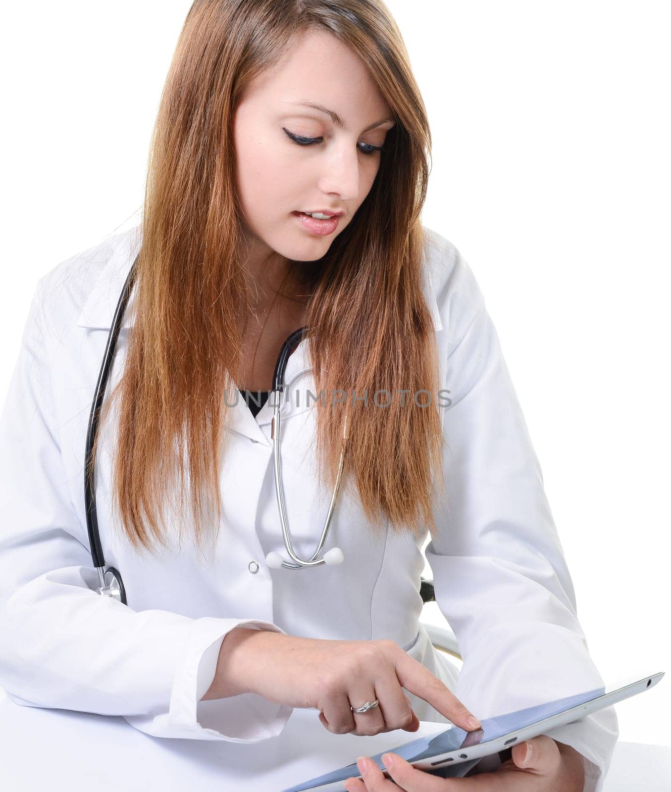 Pretty female student doctor working with an digital tablet