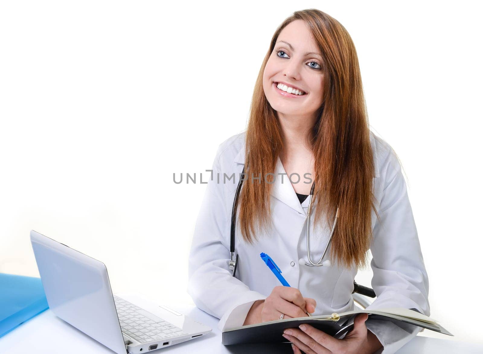 Pretty female doctor isolated writing in a Planner