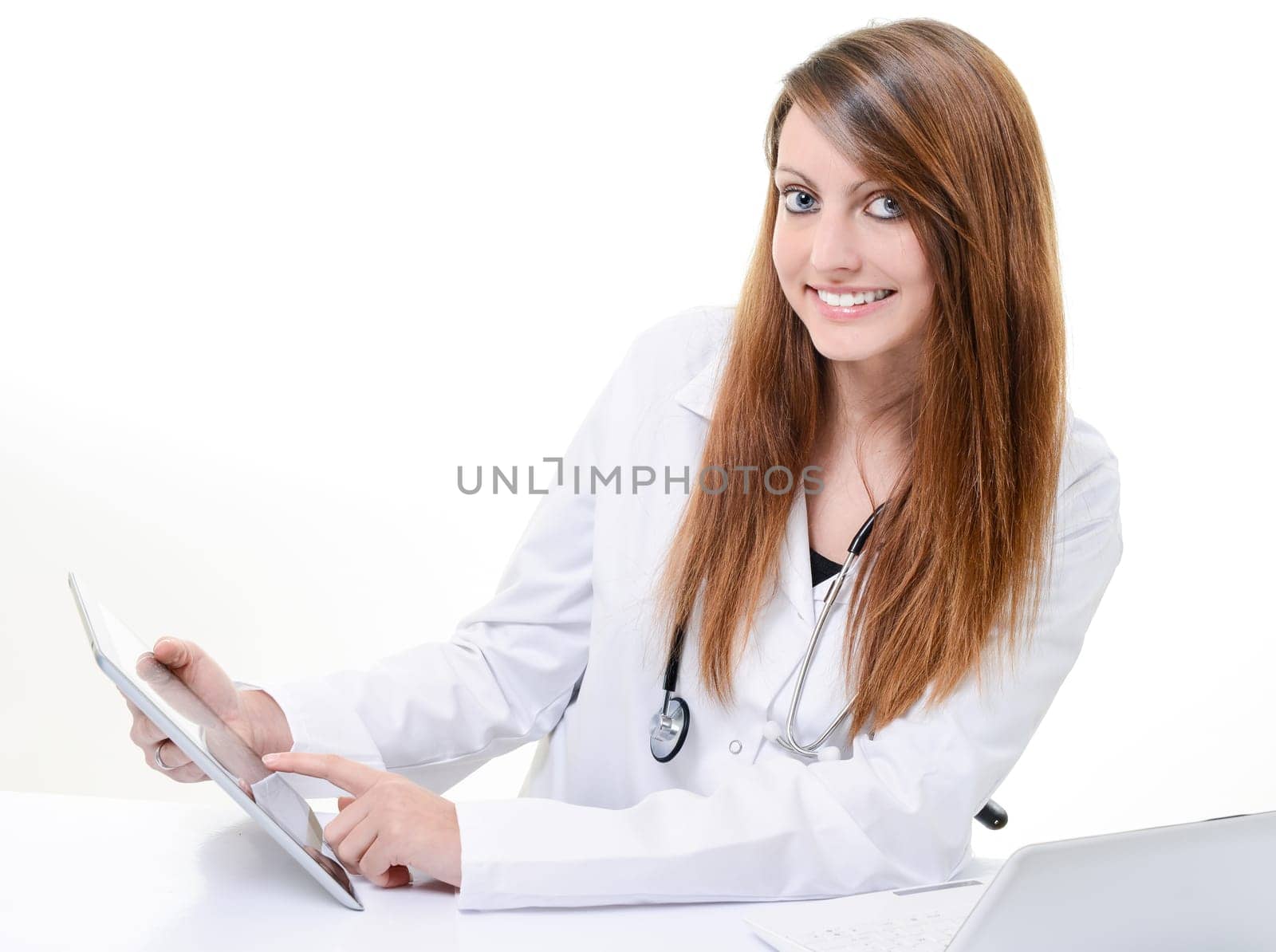 Pretty female student doctor working with an digital tablet