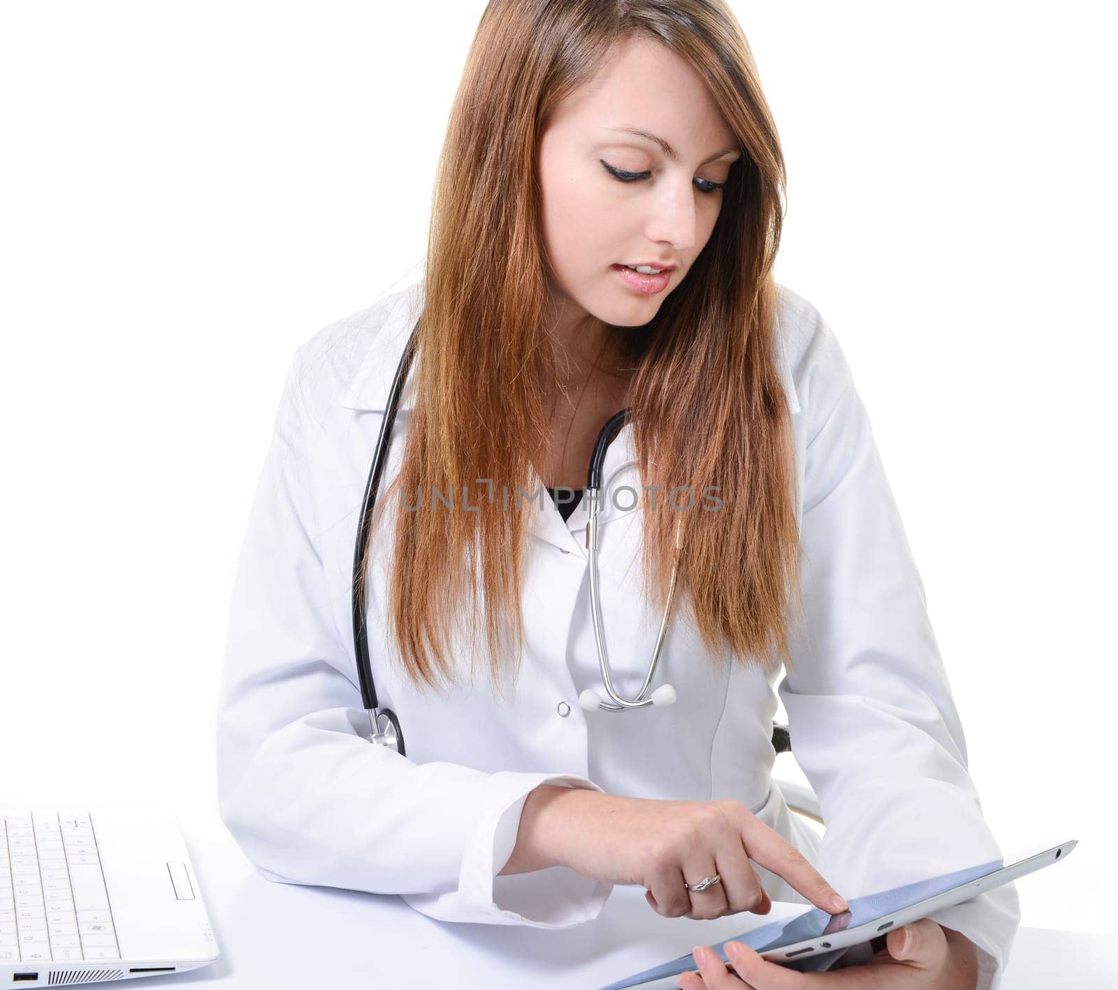 Pretty female student doctor working with an digital tablet