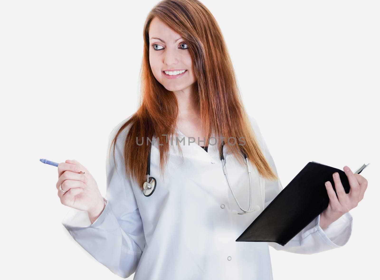 Pretty female doctor isolated writing in a Planner