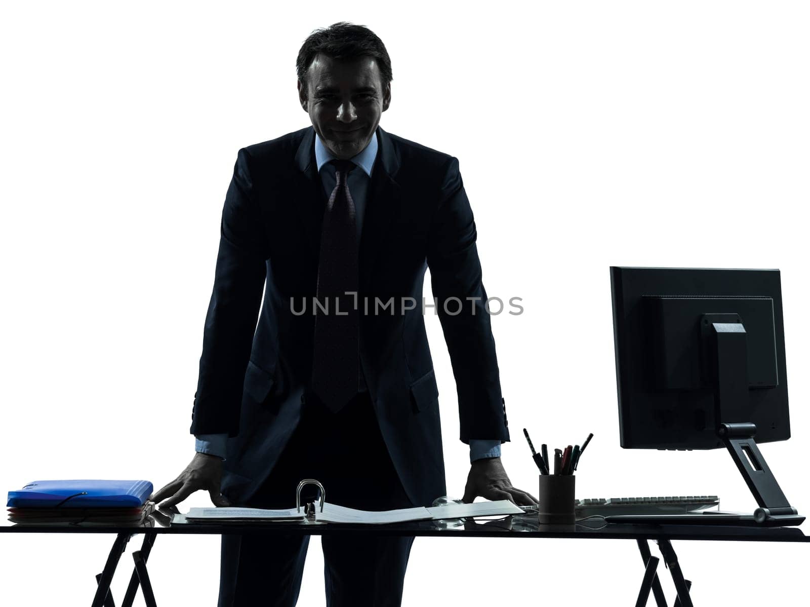 one caucasian business man smiling friendly in silhouette studio isolated on white background