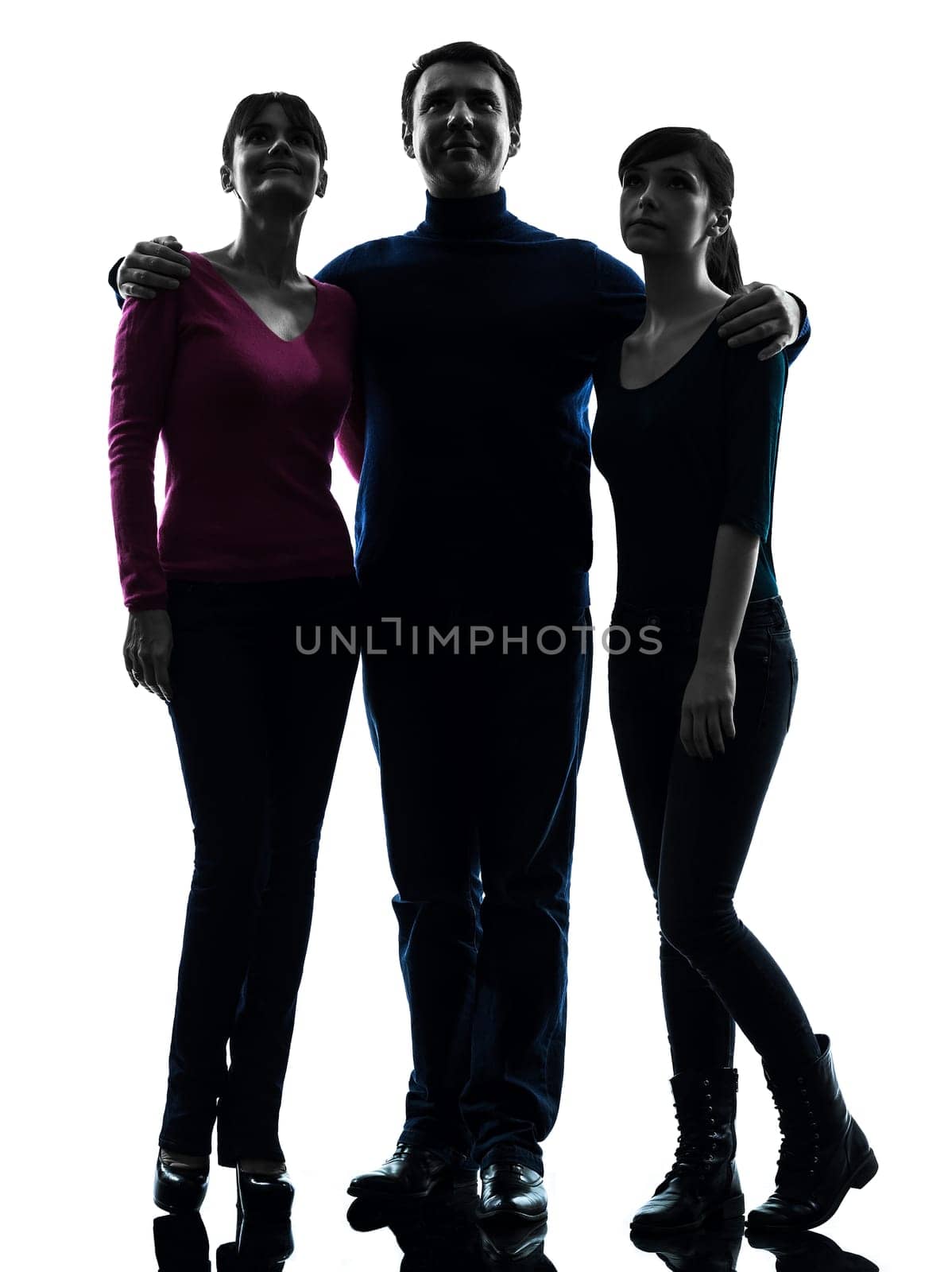 one caucasian family father mother daughter standing full length looking up  in silhouette studio isolated on white background