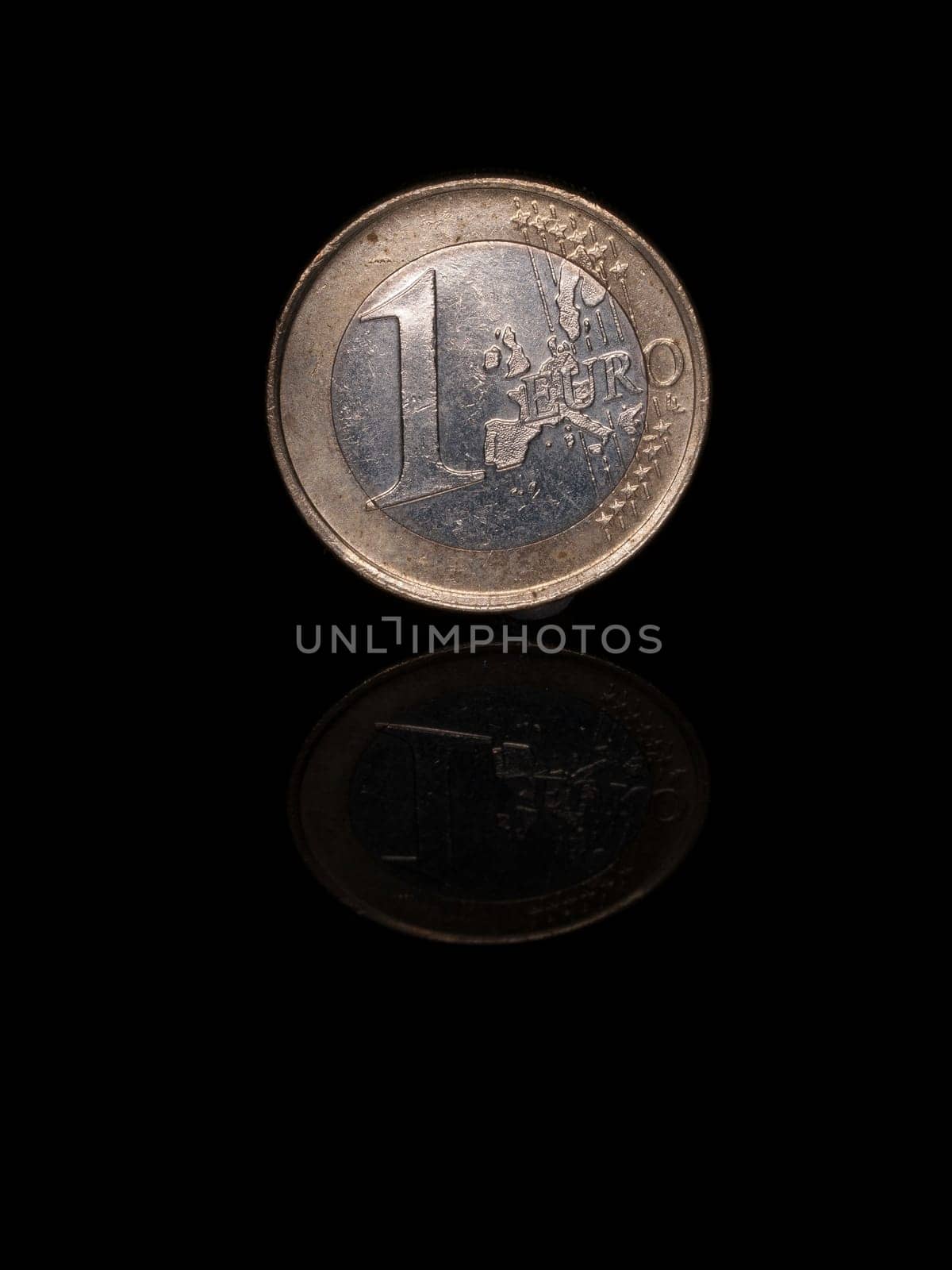 Reflected Euro coin on black